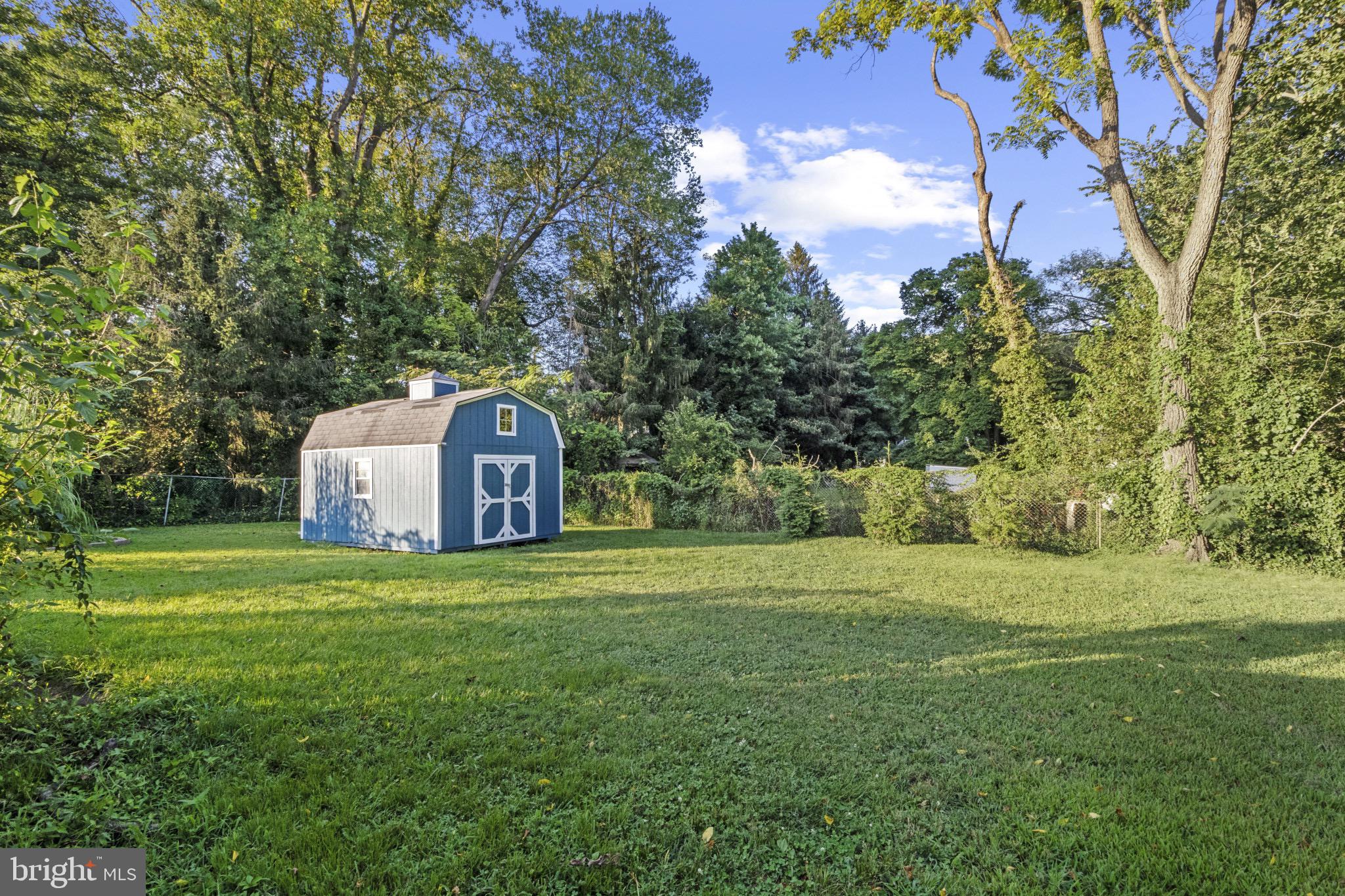113 Risdon Street Mount Holly, NJ 08060 - Photo 24 of 25 Charming shed nestled in a lush green oasis.