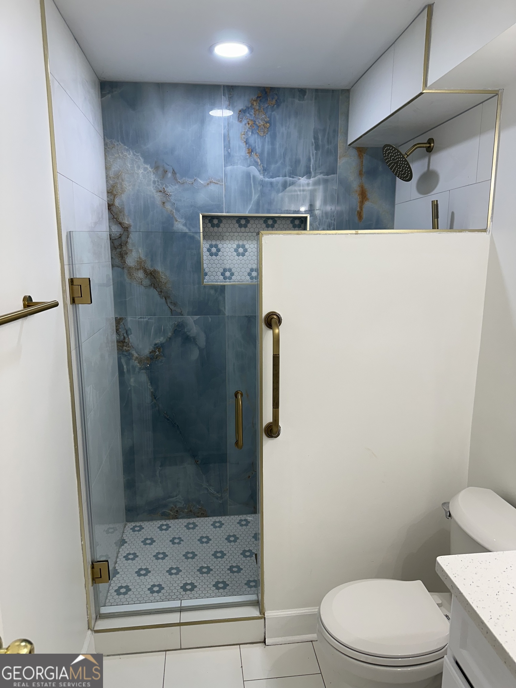 1261 Lavista Road Northeast, Unit N8 Atlanta, GA 30324 - Photo 15 of 29 a bathroom with a toilet and a shower