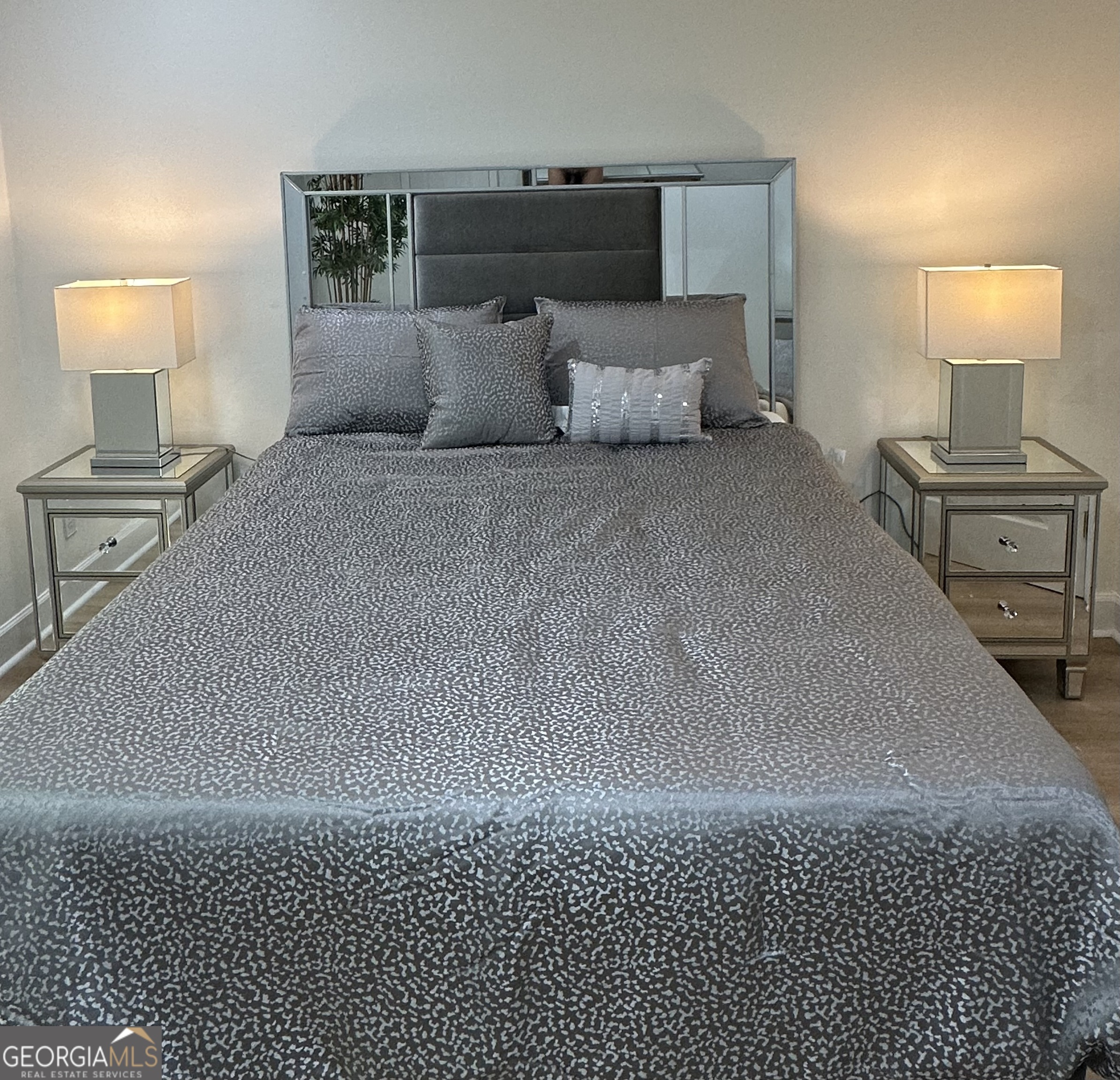 1261 Lavista Road Northeast, Unit N8 Atlanta, GA 30324 - Photo 16 of 29 a bedroom with a bed and a lamp