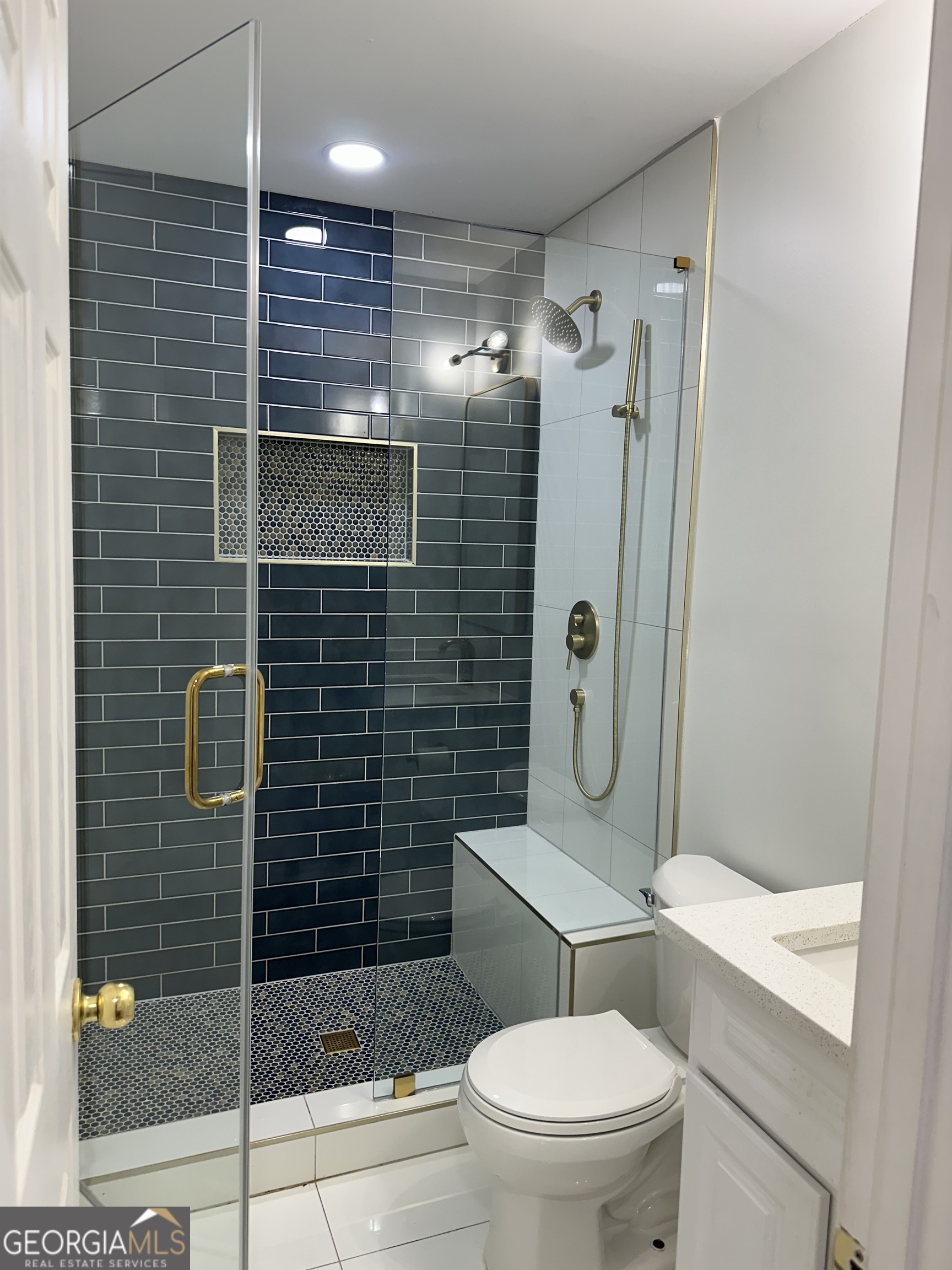 1261 Lavista Road Northeast, Unit N8 Atlanta, GA 30324 - Photo 17 of 29 a bathroom with a toilet a shower and sink