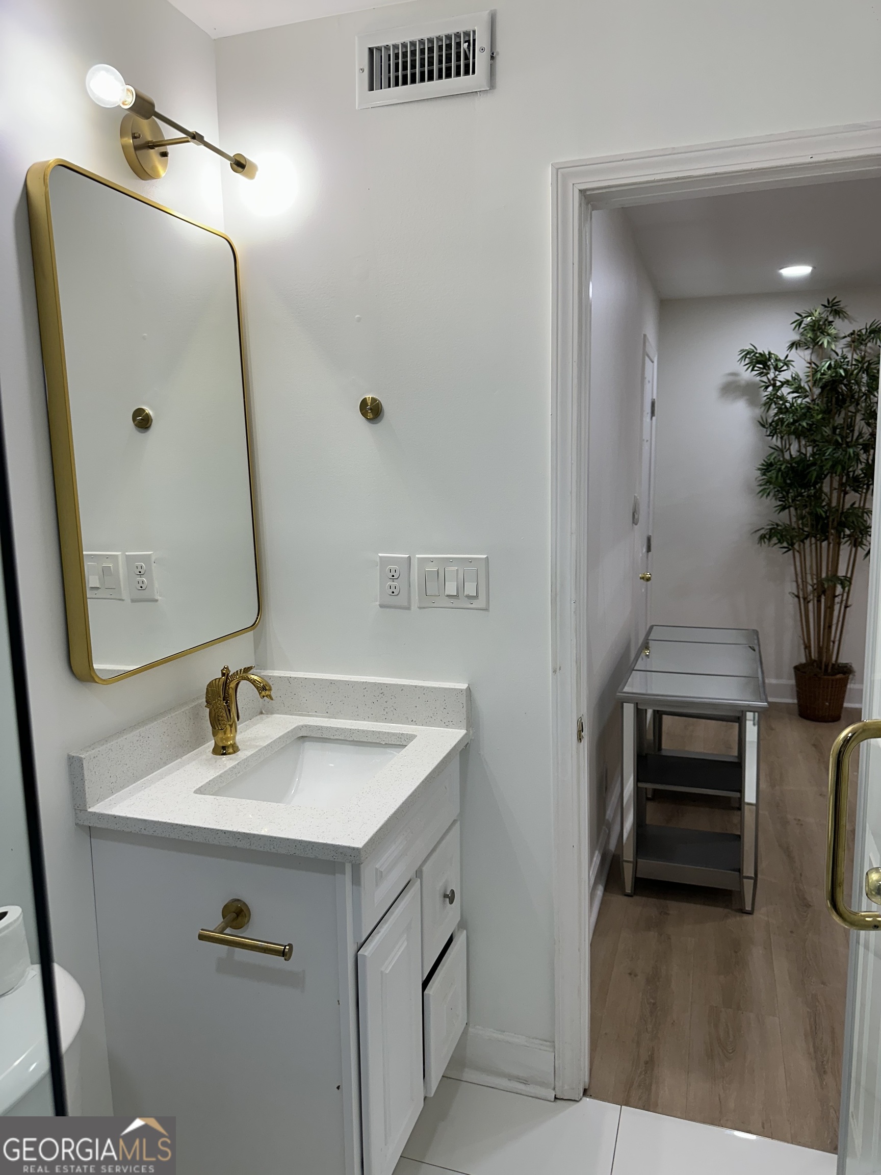 1261 Lavista Road Northeast, Unit N8 Atlanta, GA 30324 - Photo 18 of 29 a bathroom with a sink and a mirror