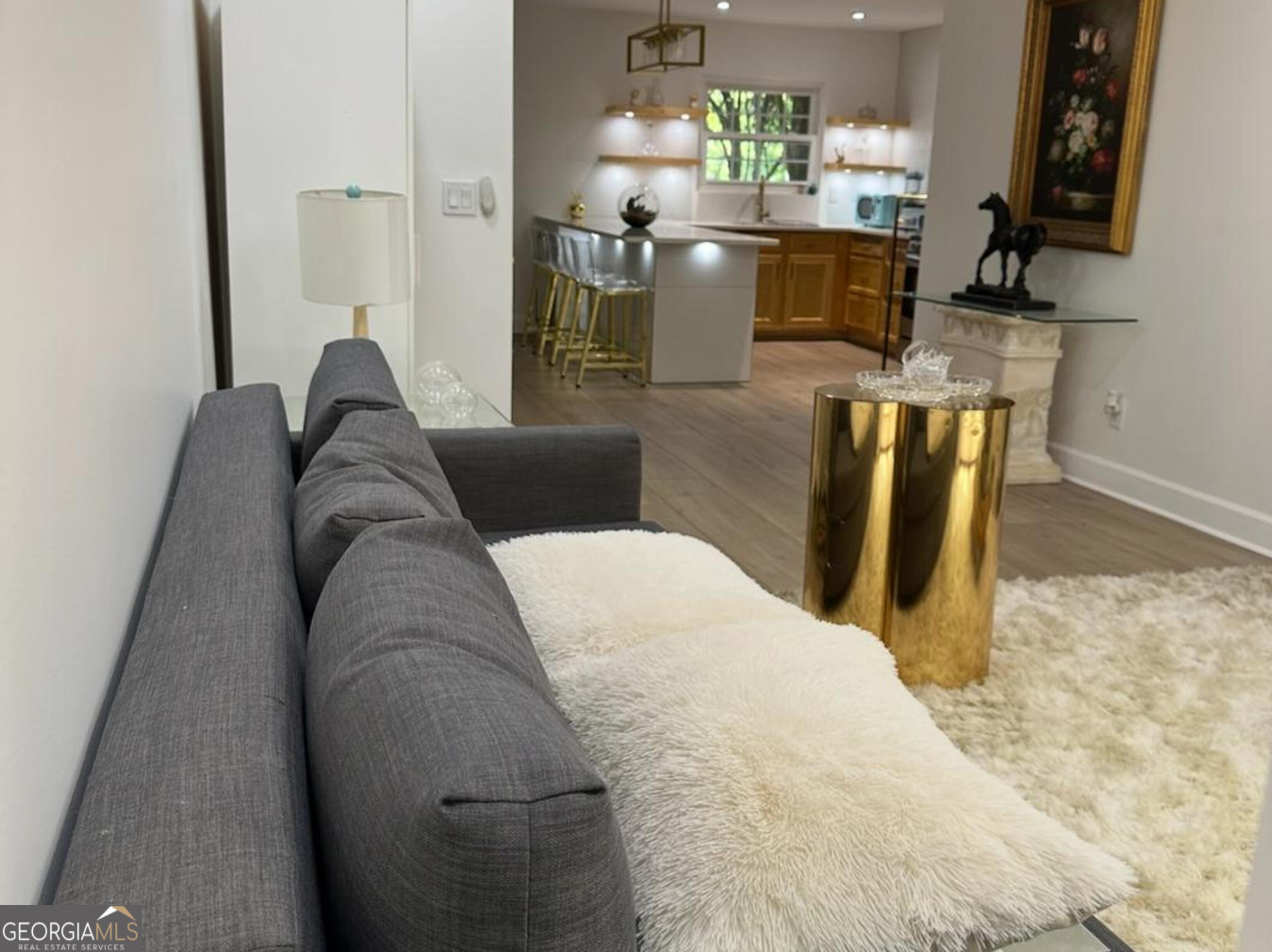 1261 Lavista Road Northeast, Unit N8 Atlanta, GA 30324 - Photo 2 of 29 a living room with granite countertop furniture a fireplace and a flat screen tv