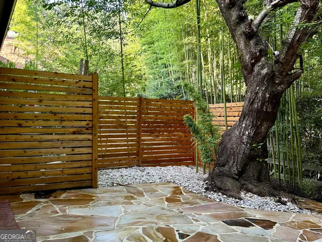 a view of a backyard of the house