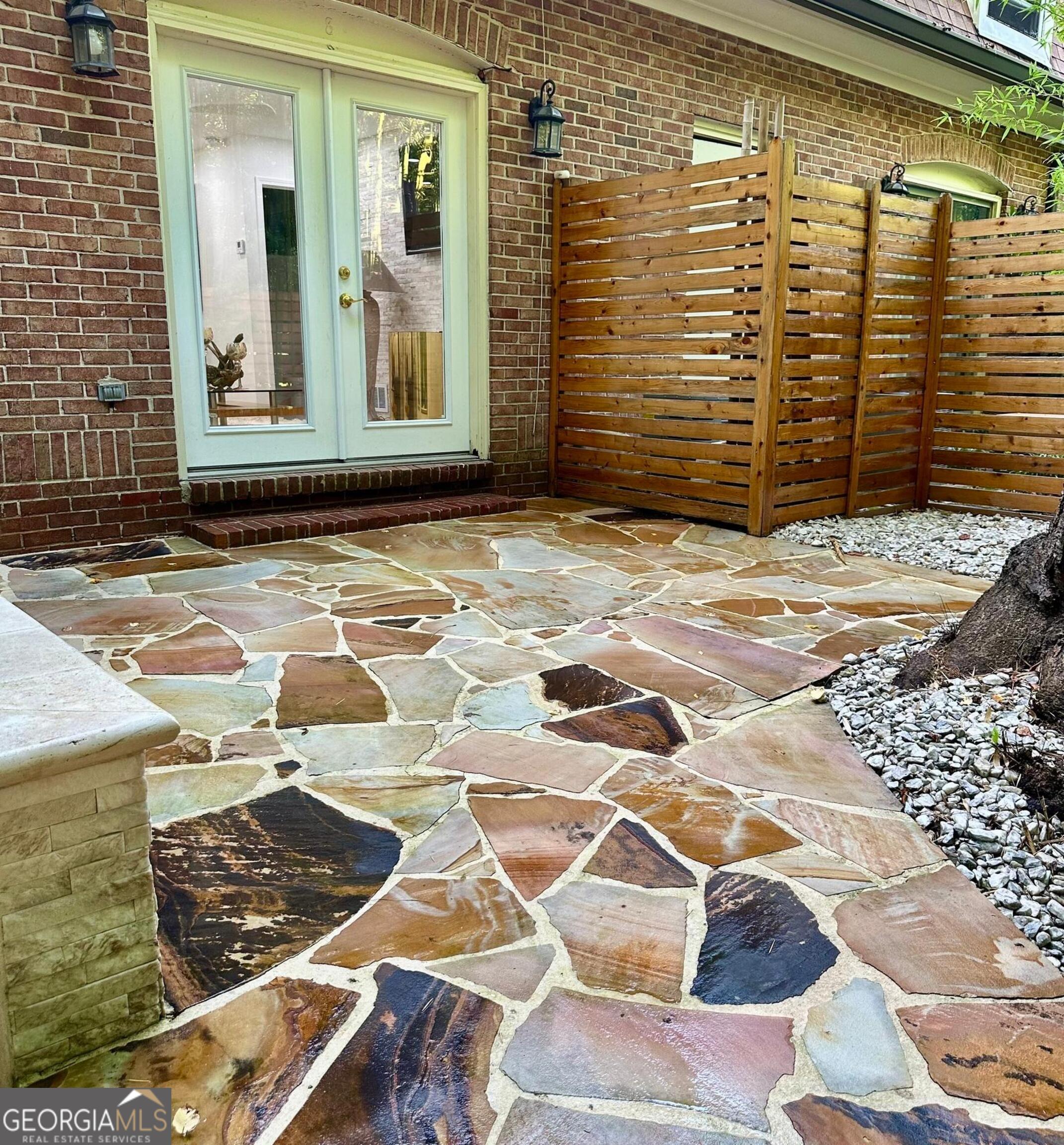 1261 Lavista Road Northeast, Unit N8 Atlanta, GA 30324 - Photo 29 of 29 a view of a brick house with a door