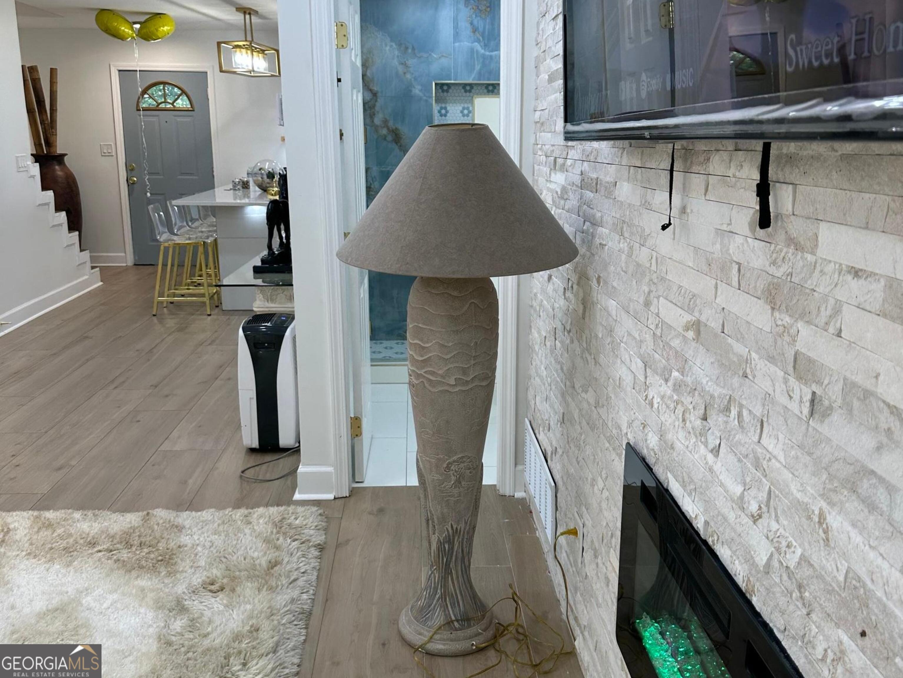 1261 Lavista Road Northeast, Unit N8 Atlanta, GA 30324 - Photo 4 of 29 a living room with furniture and a fireplace