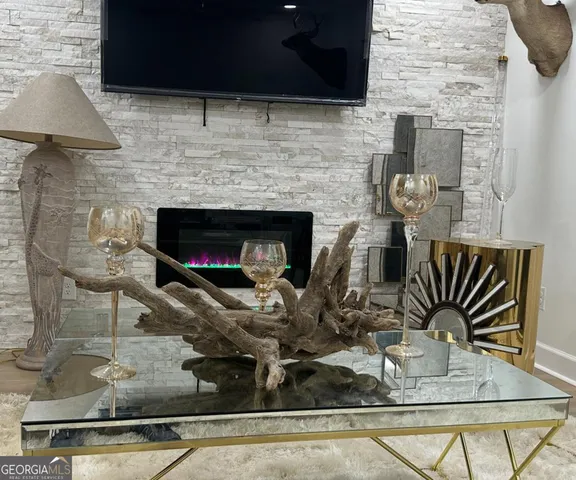 a living room with furniture gym equipment and a flat screen tv