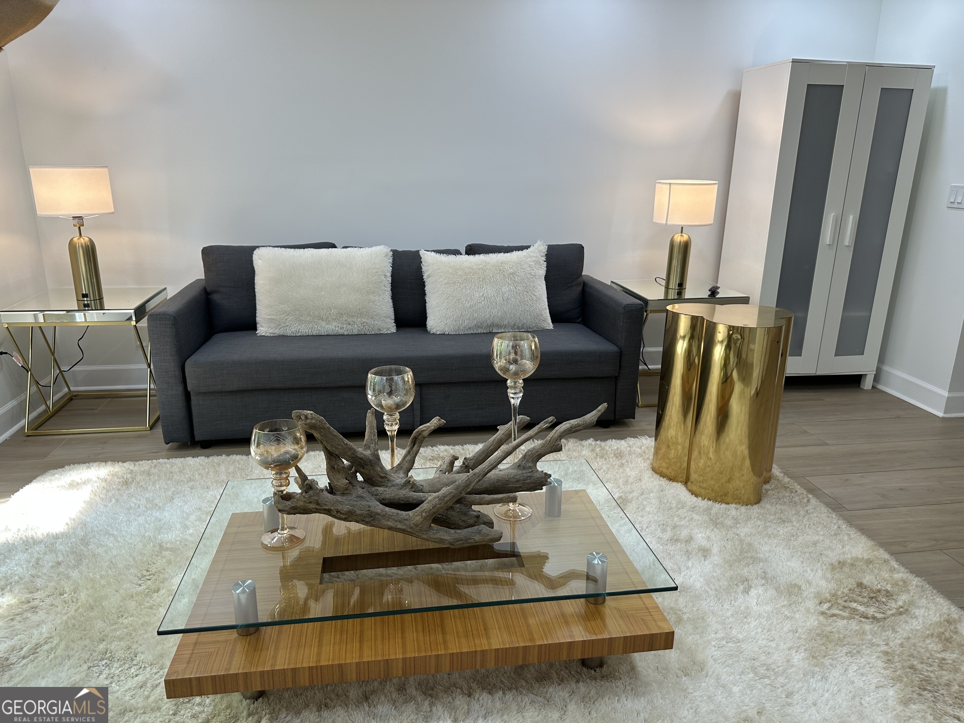 1261 Lavista Road Northeast, Unit N8 Atlanta, GA 30324 - Photo 6 of 29 a living room with furniture gym equipment and a flat screen tv