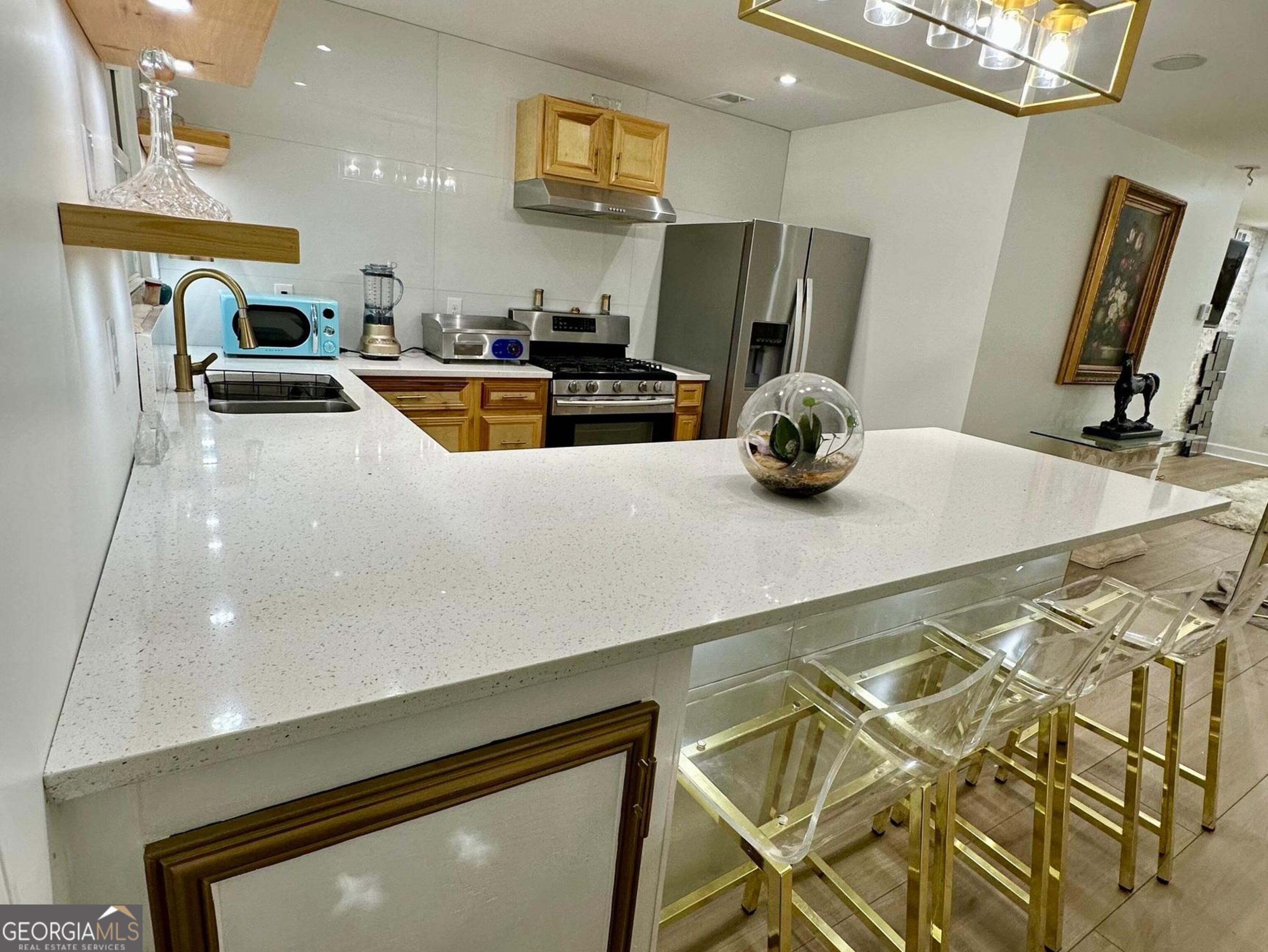 1261 Lavista Road Northeast, Unit N8 Atlanta, GA 30324 - Photo 7 of 29 a kitchen with a sink appliances and cabinets