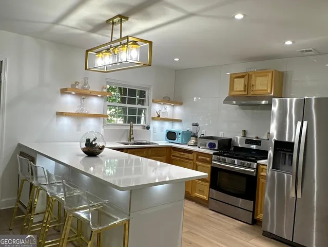 a view of a living room and a large window