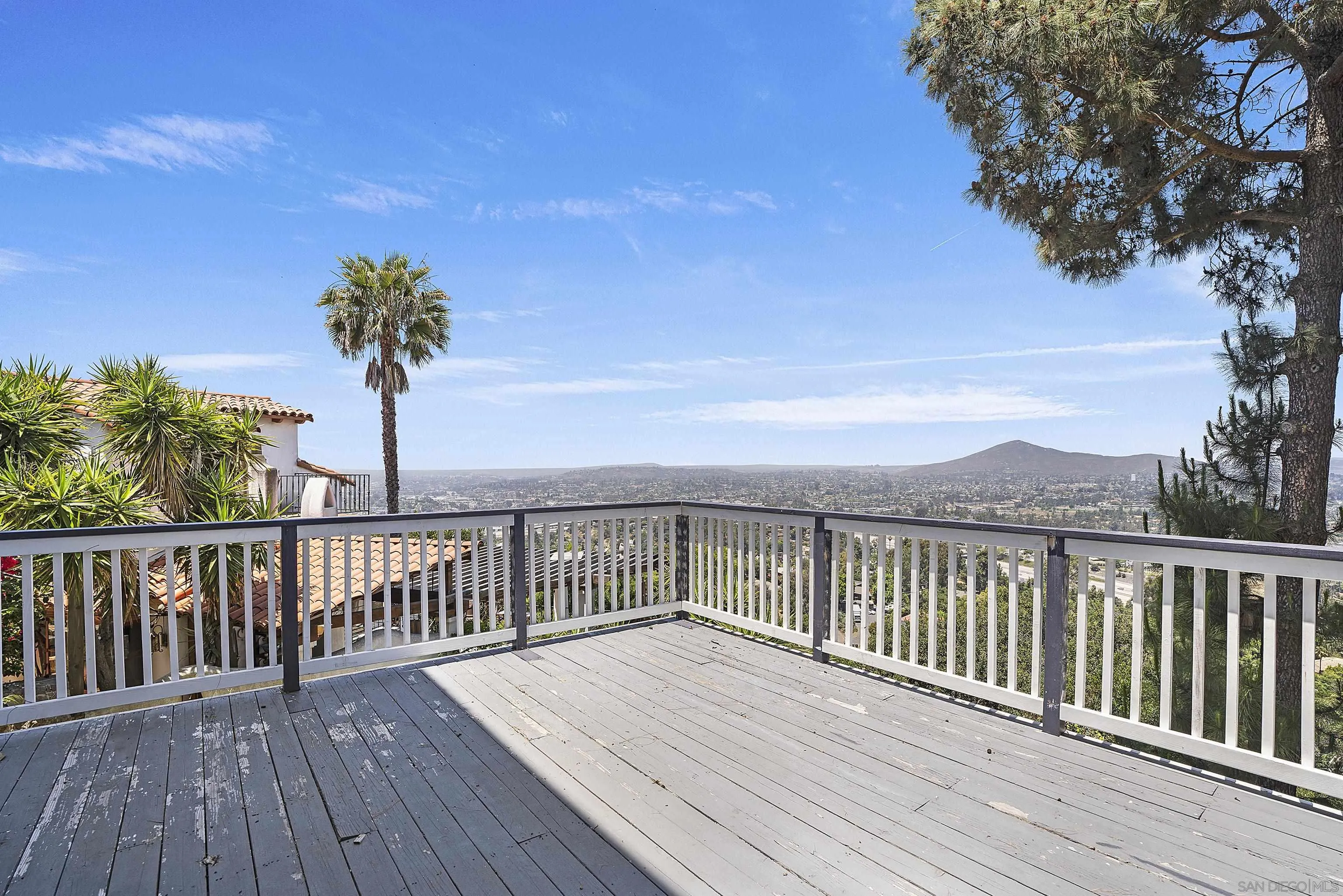 9612 Summit Circle La Mesa, CA 91941 - Photo 19 of 35 a view of deck with wooden floor and palm trees