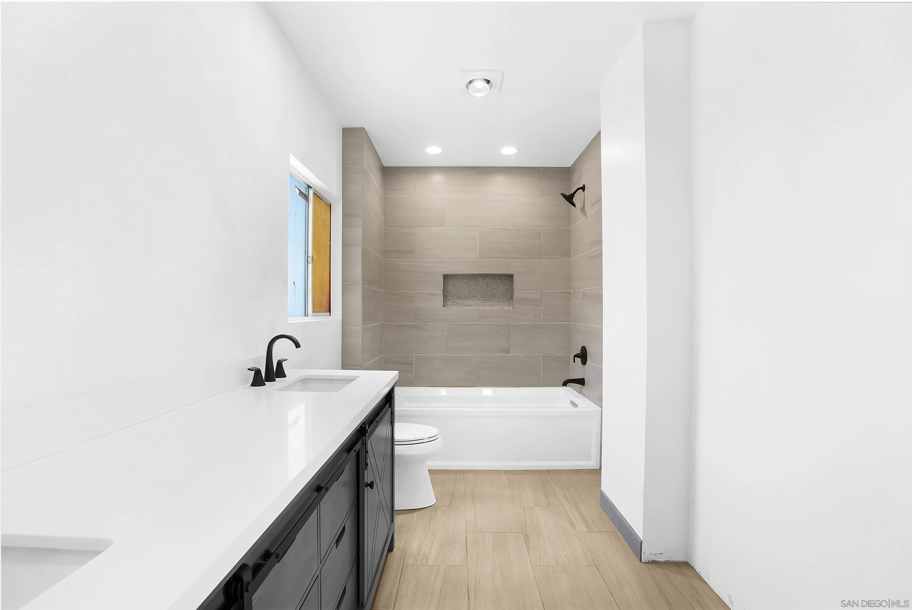 9612 Summit Circle La Mesa, CA 91941 - Photo 32 of 35 a bathroom with a sink a toilet and shower