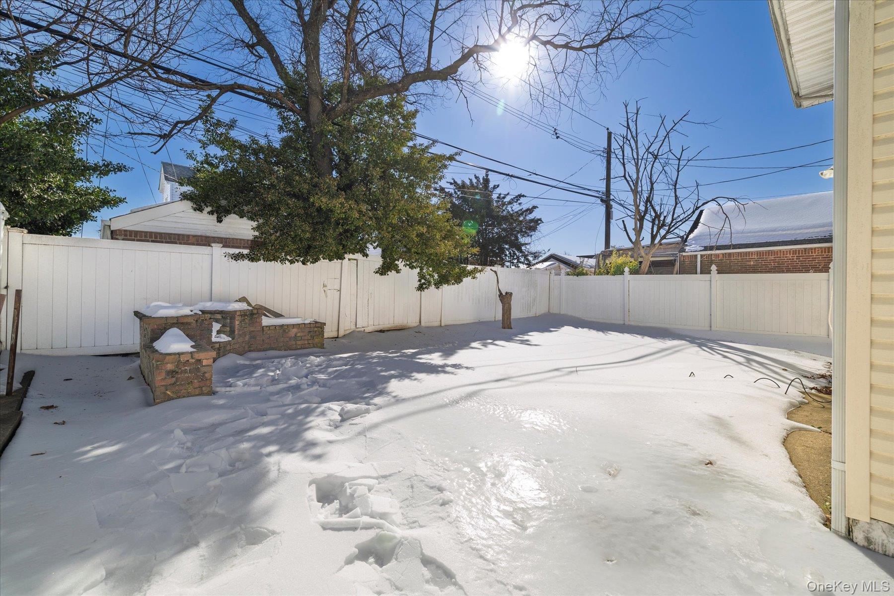 143 Wellington Road Elmont, NY 11003 - Photo 20 of 24 a backyard of a house