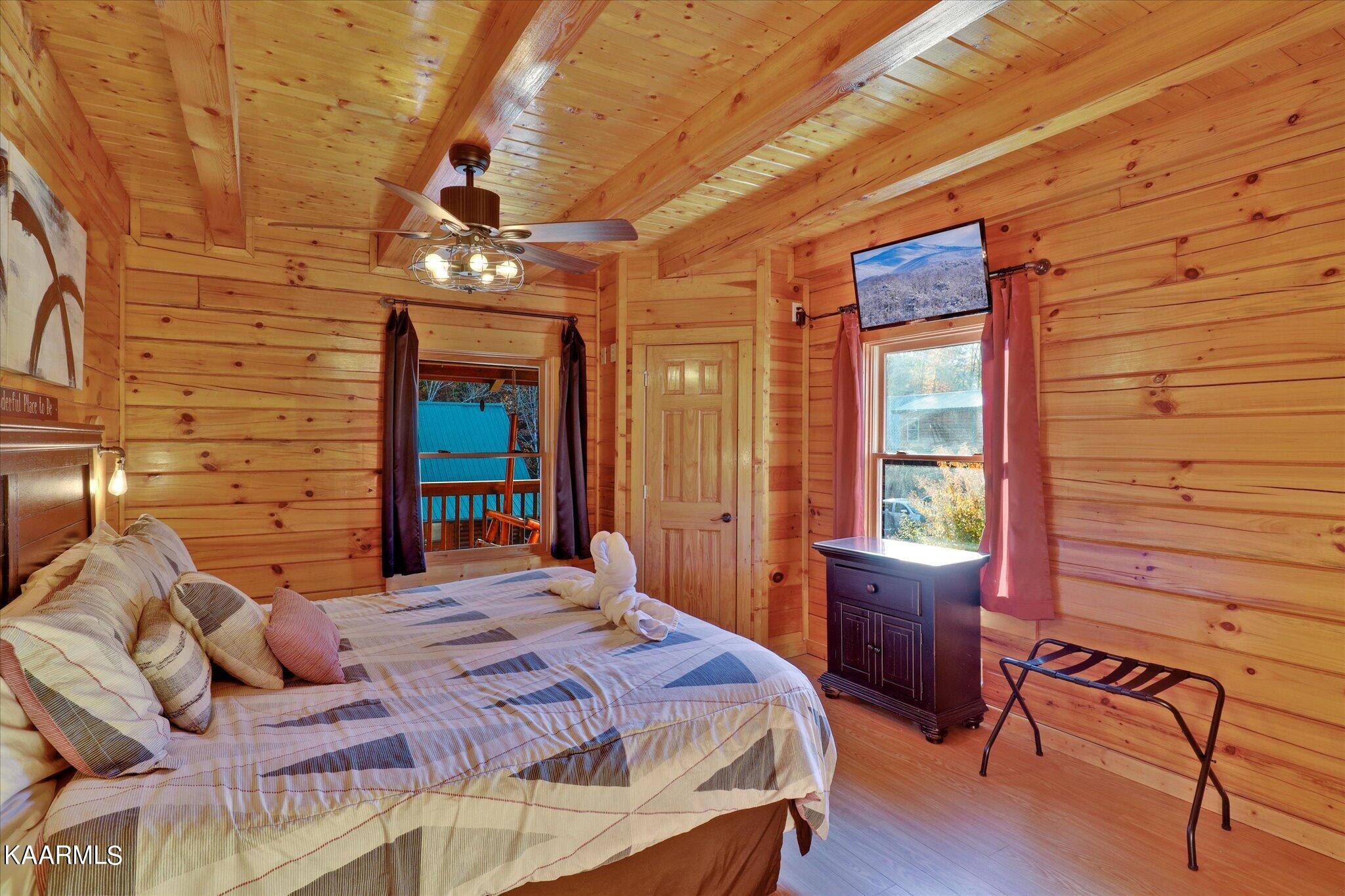 522 Blackberry Rdg Way Sevierville, TN 37863 - Photo 15 of 48 a bedroom with a bed dresser and a window
