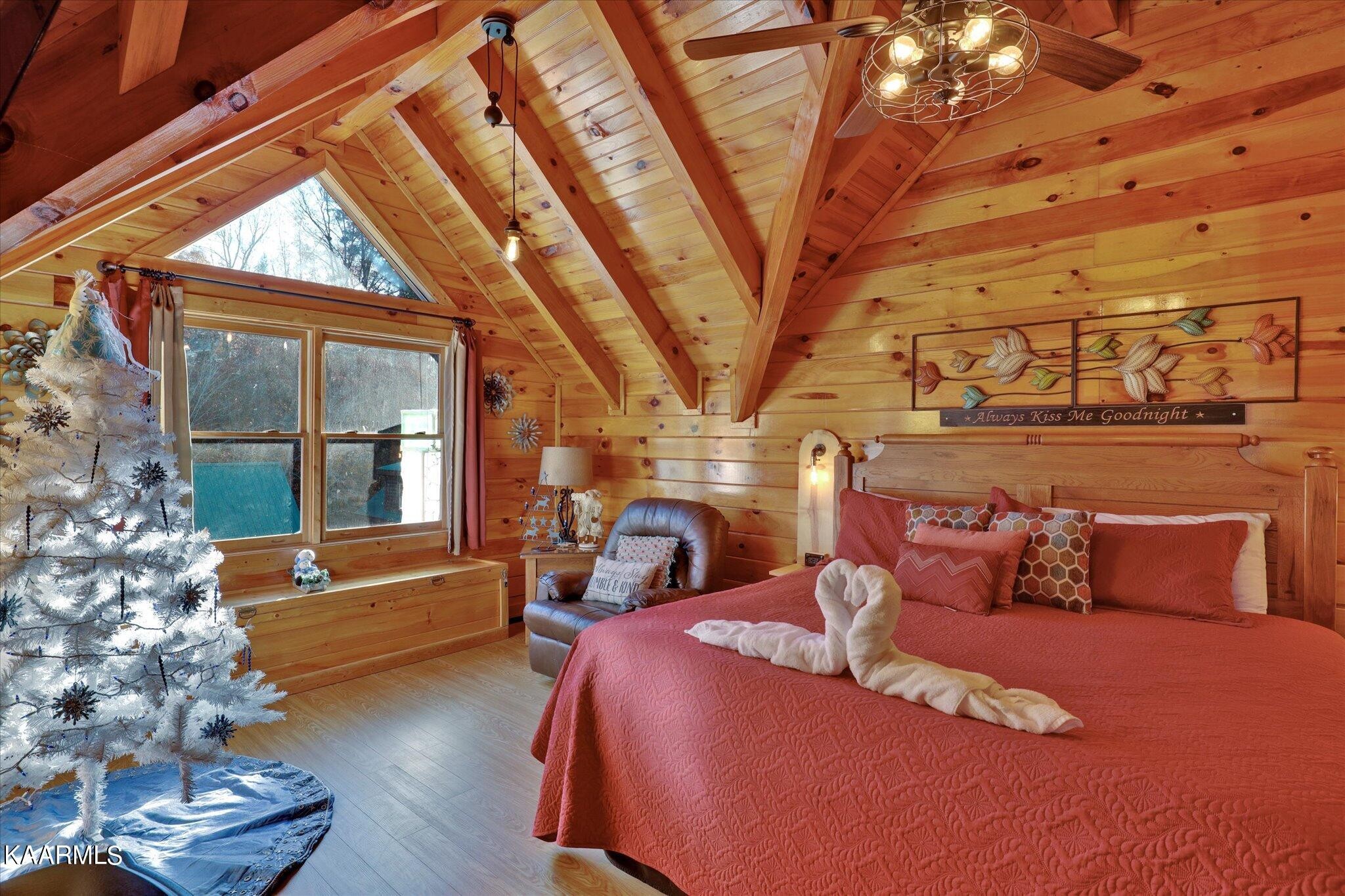 522 Blackberry Rdg Way Sevierville, TN 37863 - Photo 25 of 48 a bedroom with a bed and wooden floor