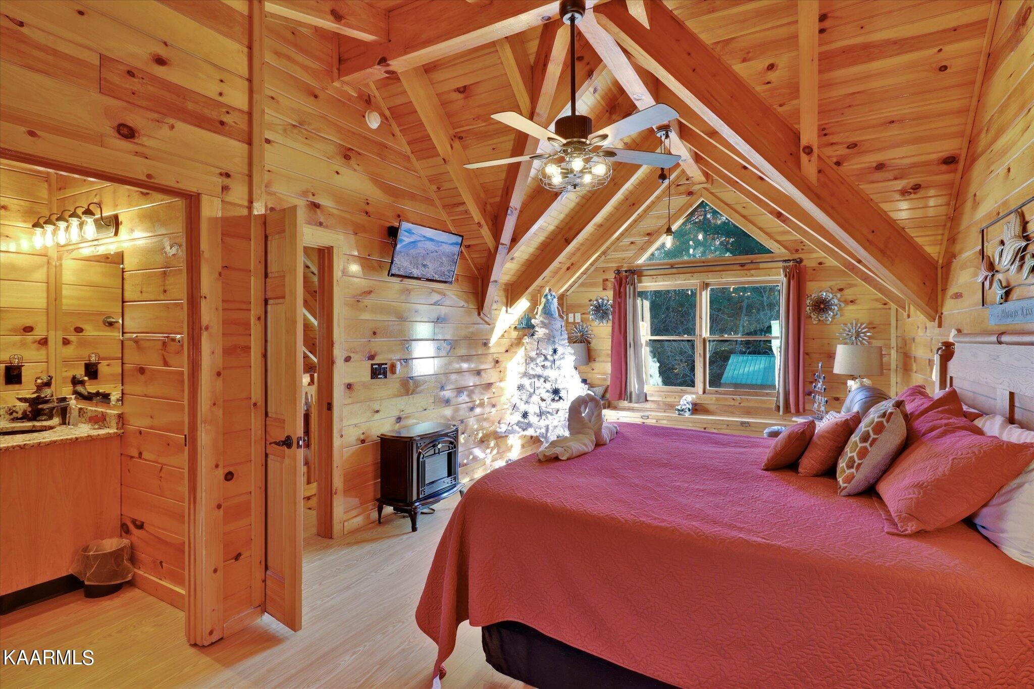 522 Blackberry Rdg Way Sevierville, TN 37863 - Photo 26 of 48 a bed room with a bed and a chandelier