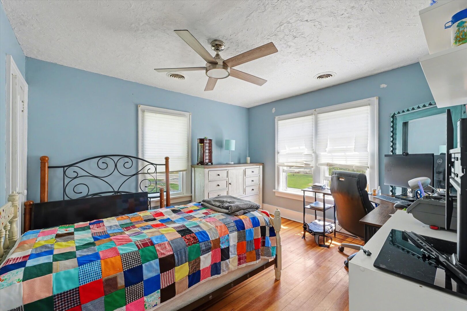 248 East Fremont Street Bement, IL 61813 - Photo 18 of 40 a bedroom with a bed a window and a chandelier