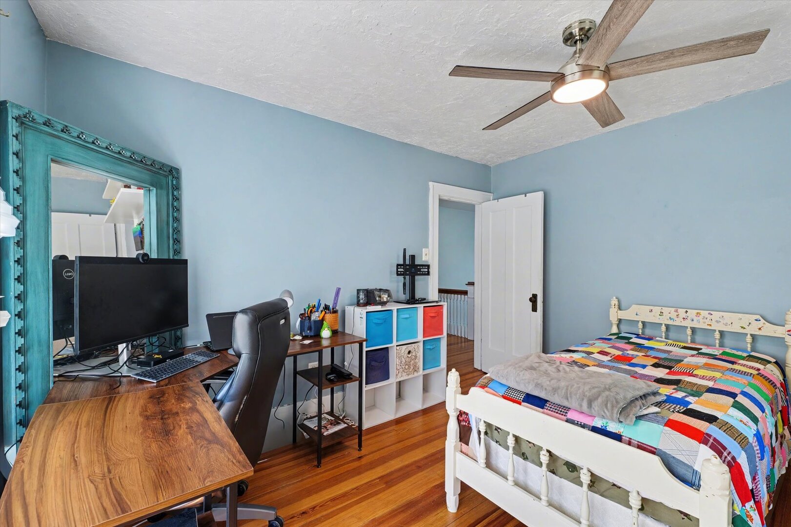 248 East Fremont Street Bement, IL 61813 - Photo 19 of 40 a bedroom with a bed and a flat screen tv