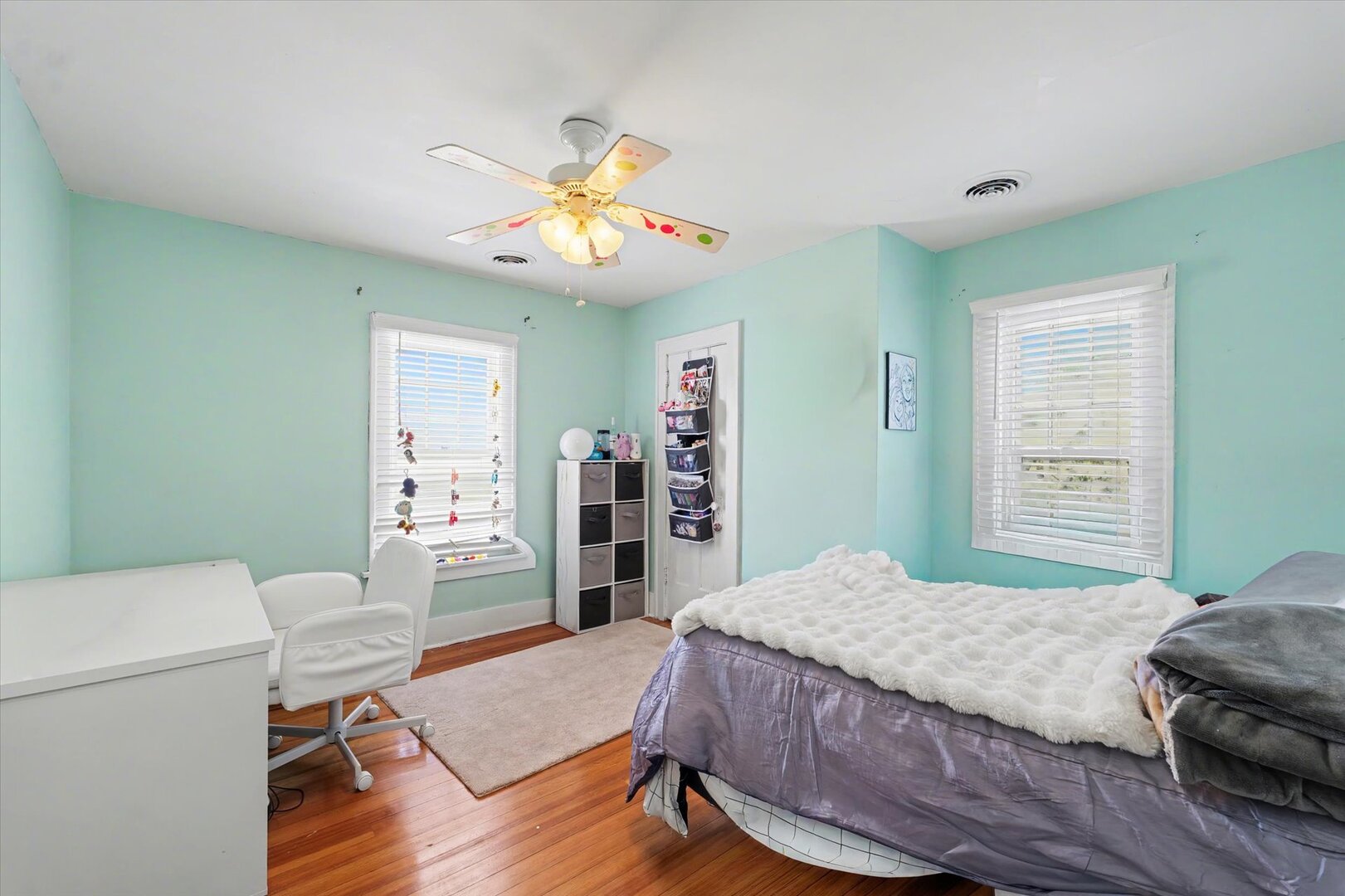 248 East Fremont Street Bement, IL 61813 - Photo 20 of 40 a bedroom with a bed and a chandelier