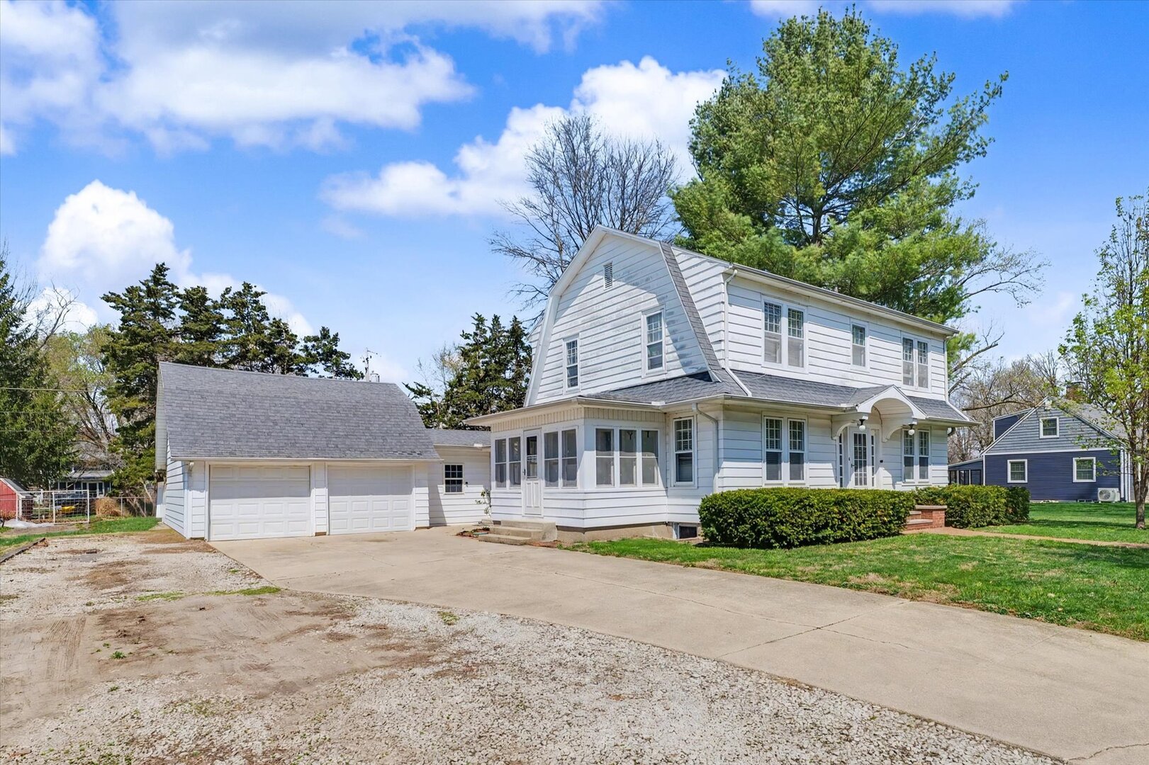 248 East Fremont Street Bement, IL 61813 - Photo 39 of 40 a front view of a house with a garden and a tree