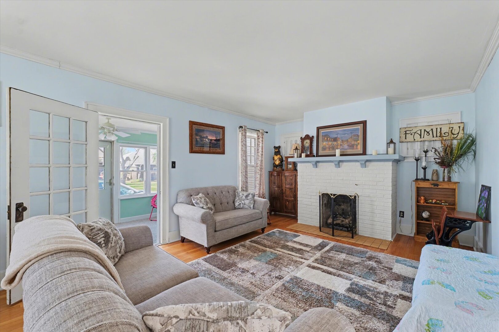 248 East Fremont Street Bement, IL 61813 - Photo 4 of 40 a living room with furniture and a fireplace