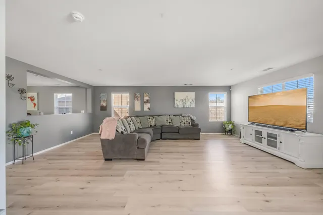 a bedroom with a bed and a dresser in it