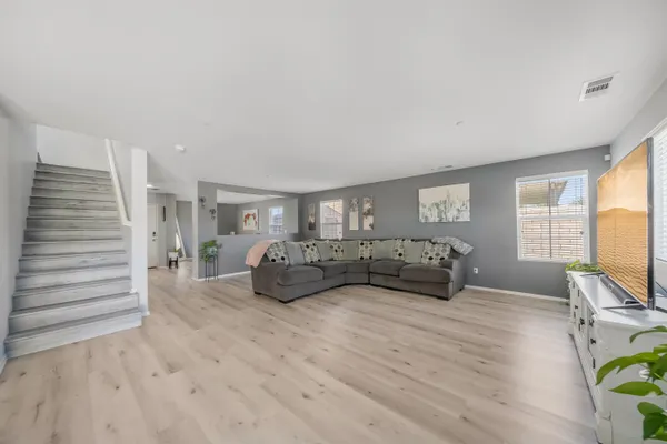 a bedroom with furniture and a window