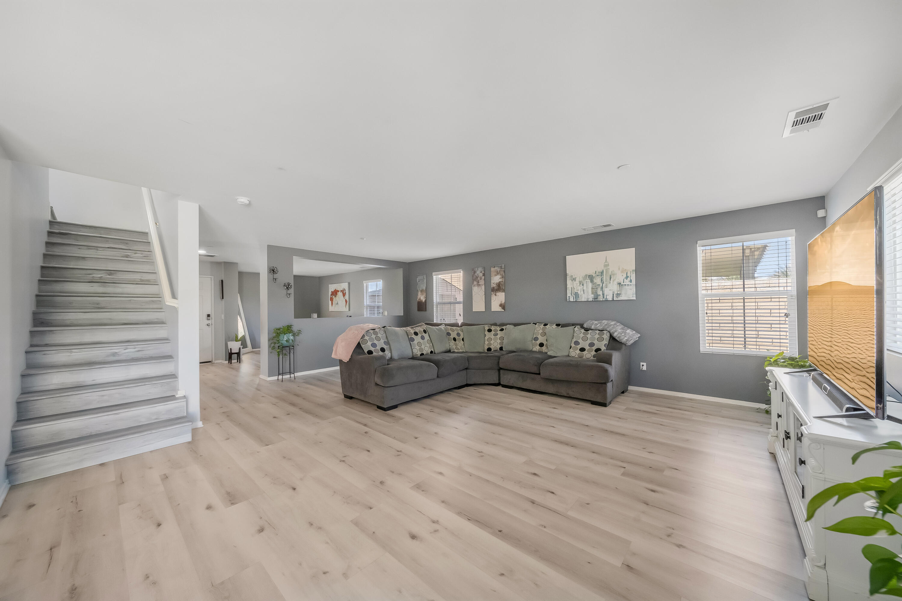 84030 Manhattan Avenue Coachella, CA 92236 - Photo 24 of 74 a living room with furniture and a flat screen tv