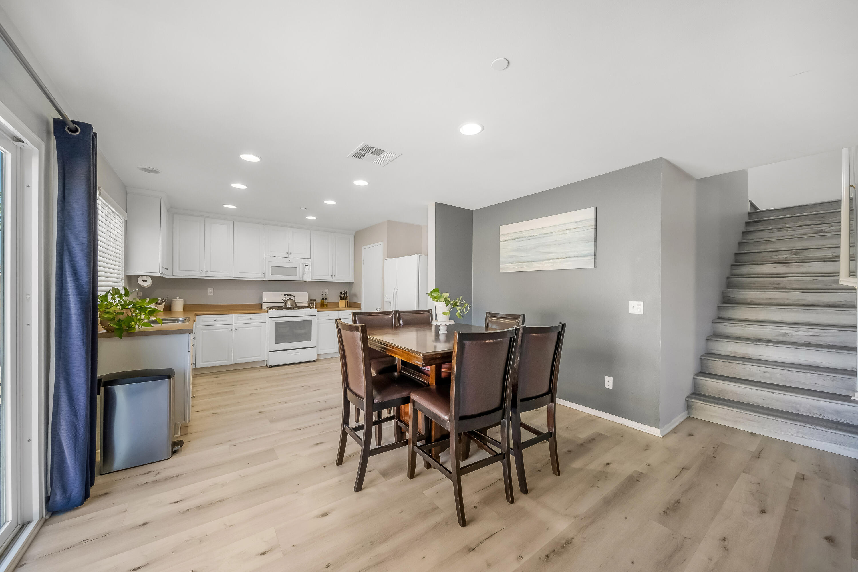 84030 Manhattan Avenue Coachella, CA 92236 - Photo 26 of 74 a view of a dining room with furniture and wooden floor