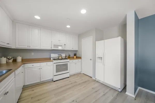 a bedroom with a bed and a dresser in it