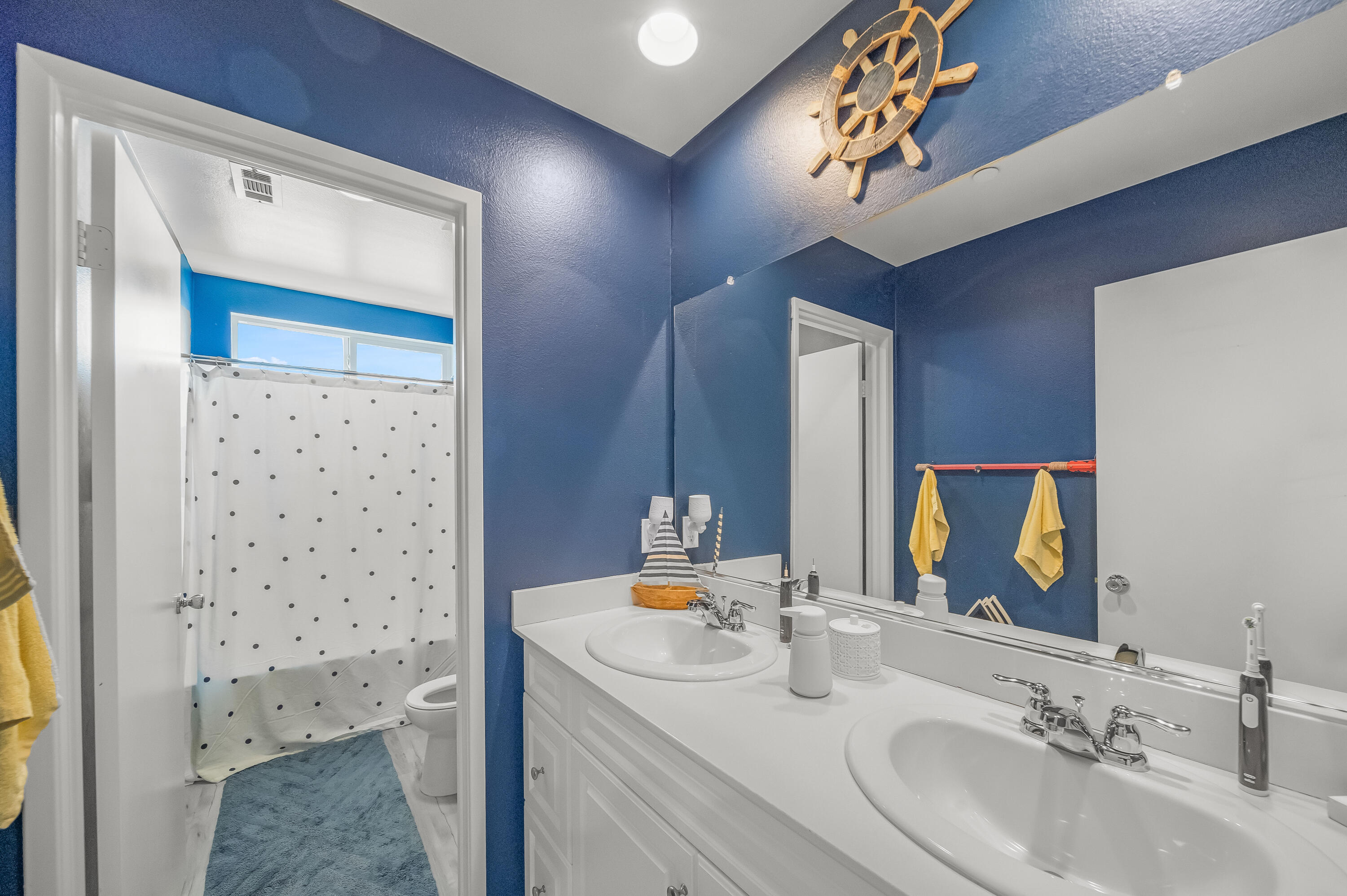 84030 Manhattan Avenue Coachella, CA 92236 - Photo 37 of 74 a bathroom with a sink a vanity and a mirror