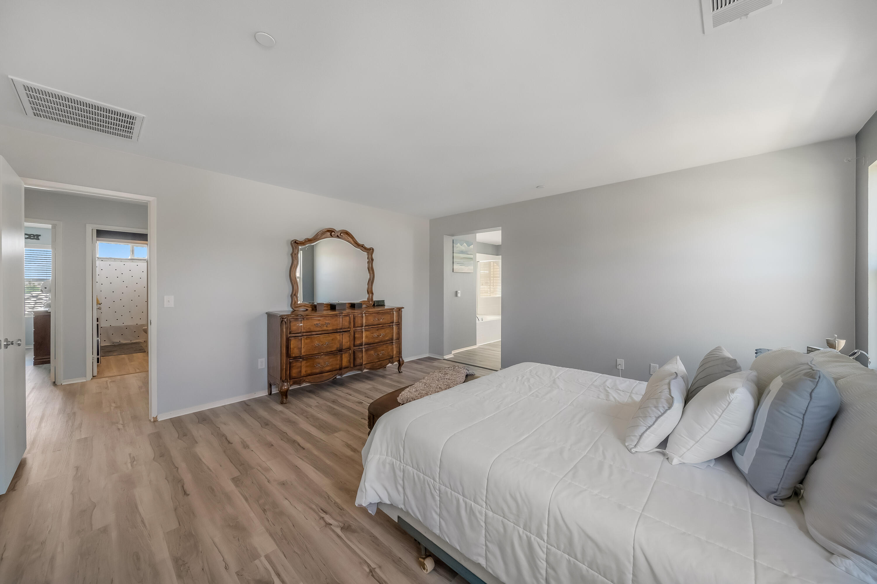 84030 Manhattan Avenue Coachella, CA 92236 - Photo 47 of 74 a bedroom with a bed and wooden floor