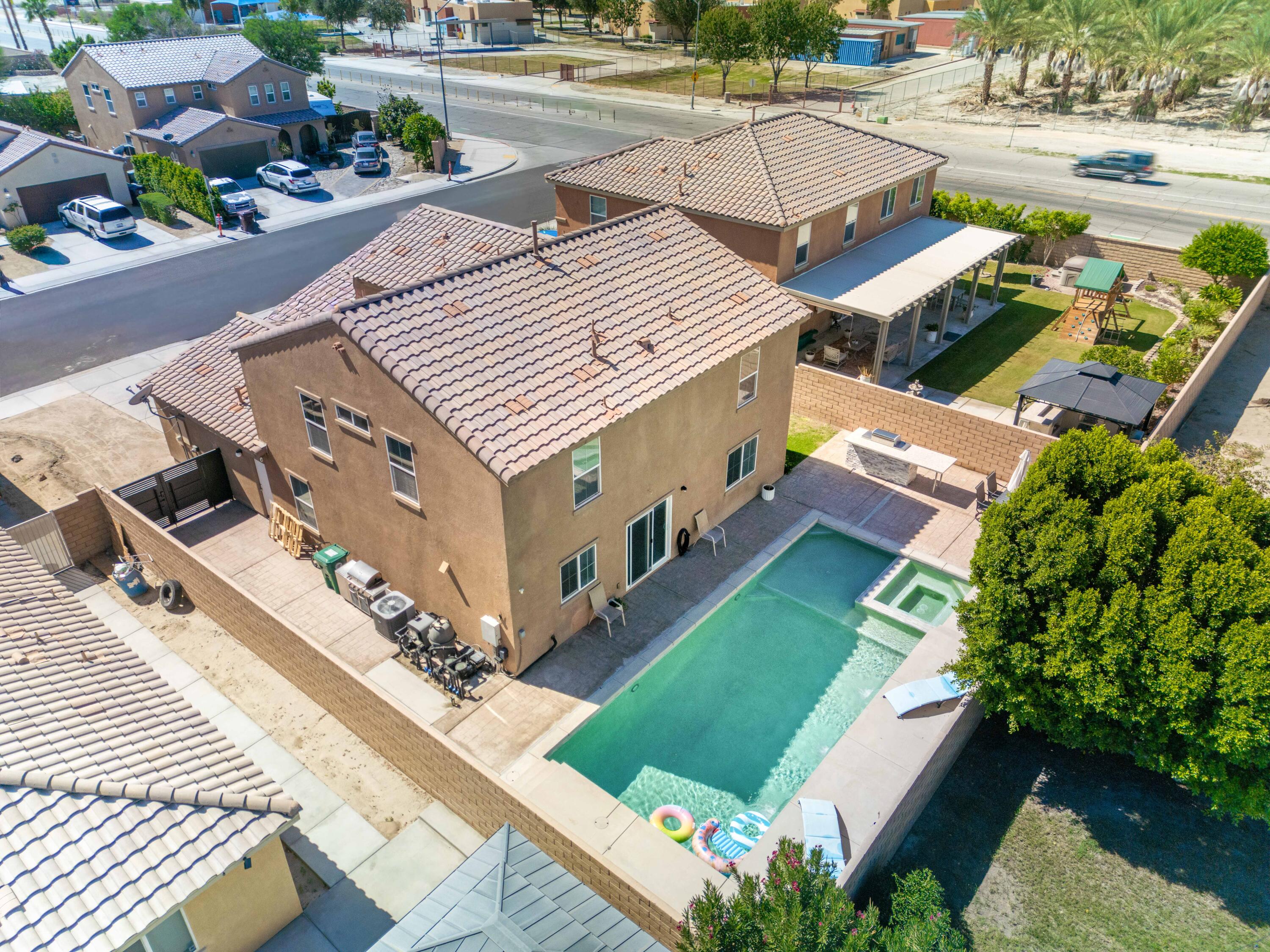 84030 Manhattan Avenue Coachella, CA 92236 - Photo 7 of 74 an aerial view of a house with garden space and street view