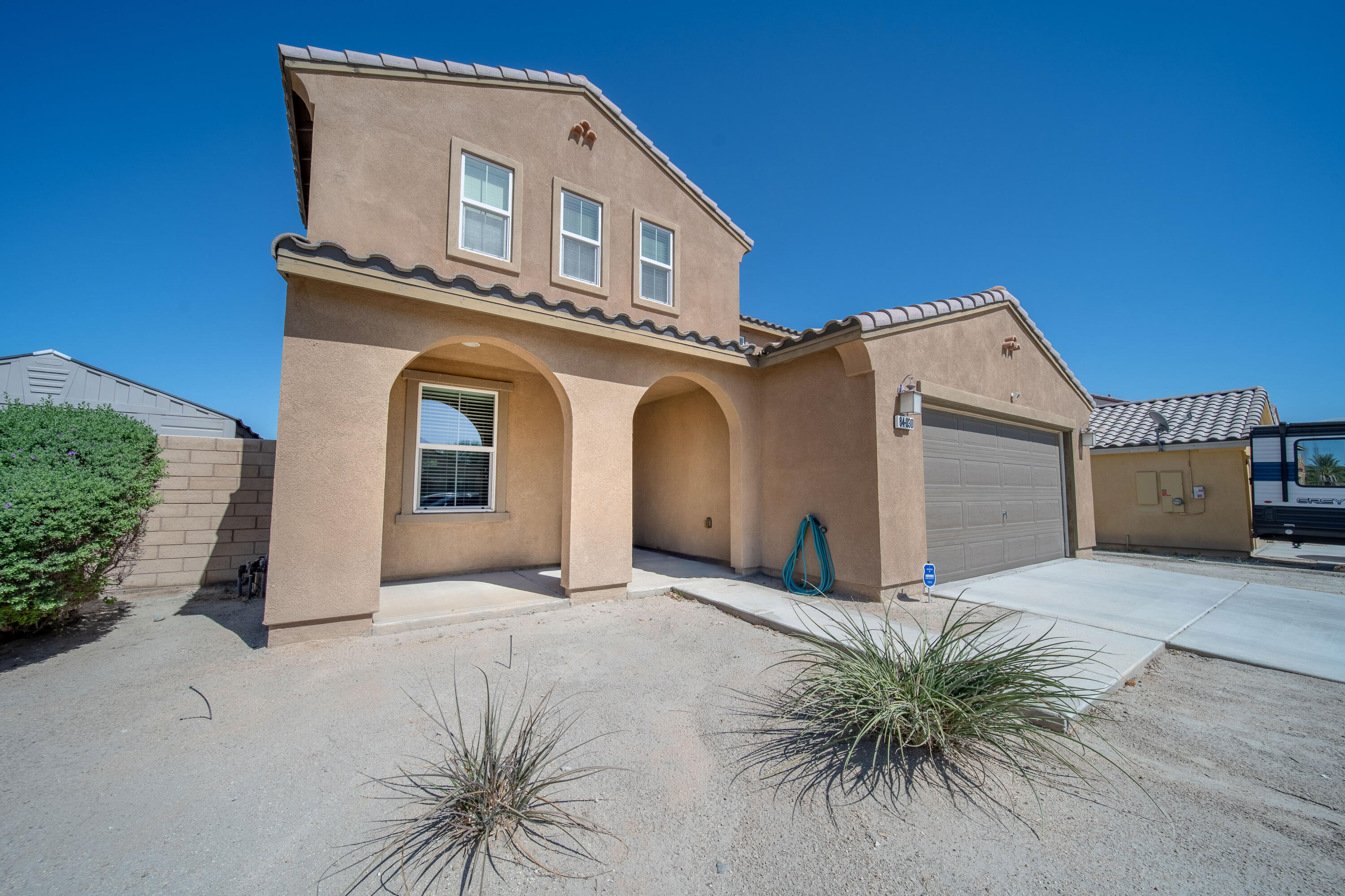 84030 Manhattan Avenue Coachella, CA 92236 - Photo 71 of 74 a front view of a house with a yard
