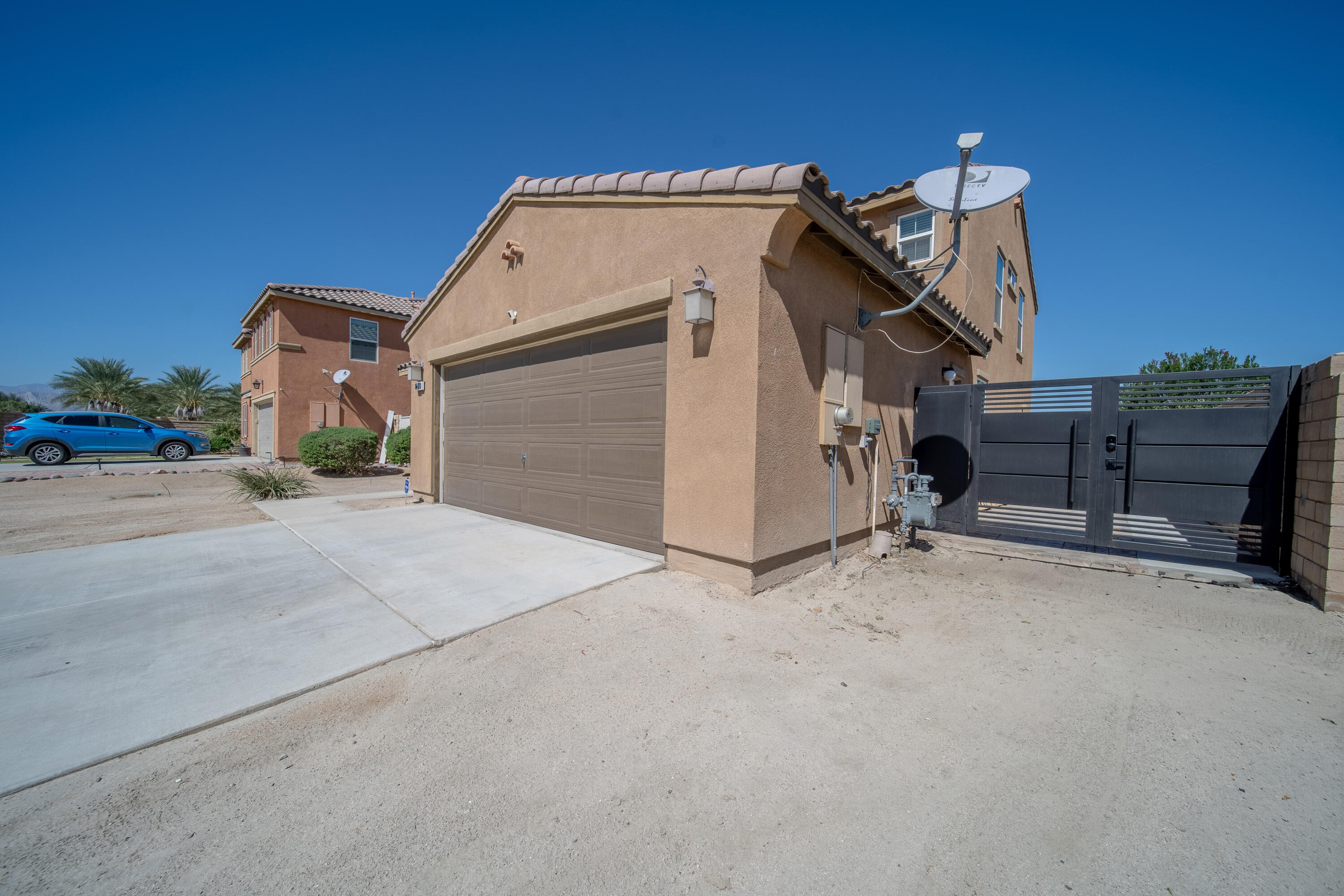 84030 Manhattan Avenue Coachella, CA 92236 - Photo 73 of 74 front view of a house with a garage
