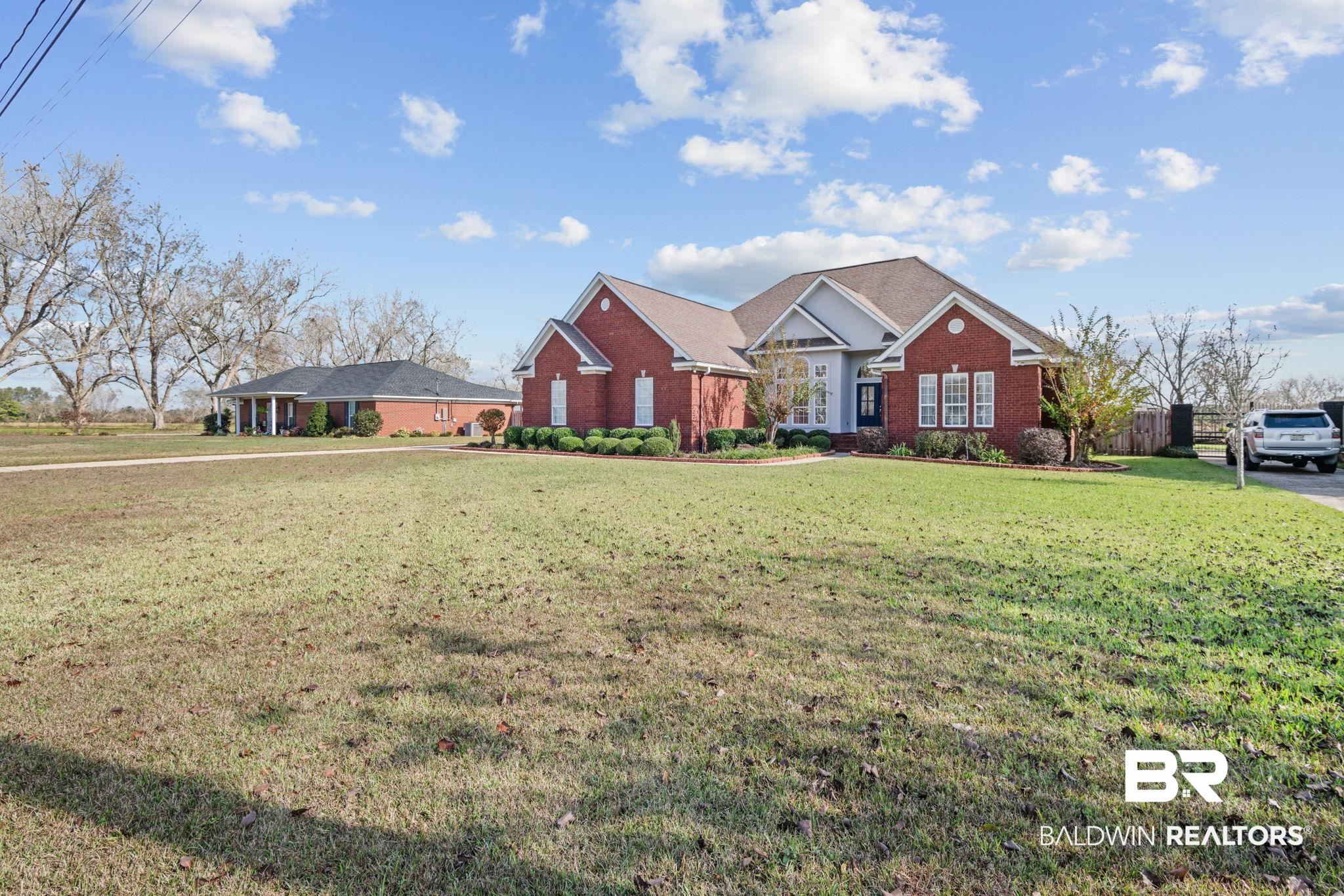 4771 Pecan Ridge East Mobile, AL 36619 - Photo 3 of 48 View of front of property with a front lawn and brick siding