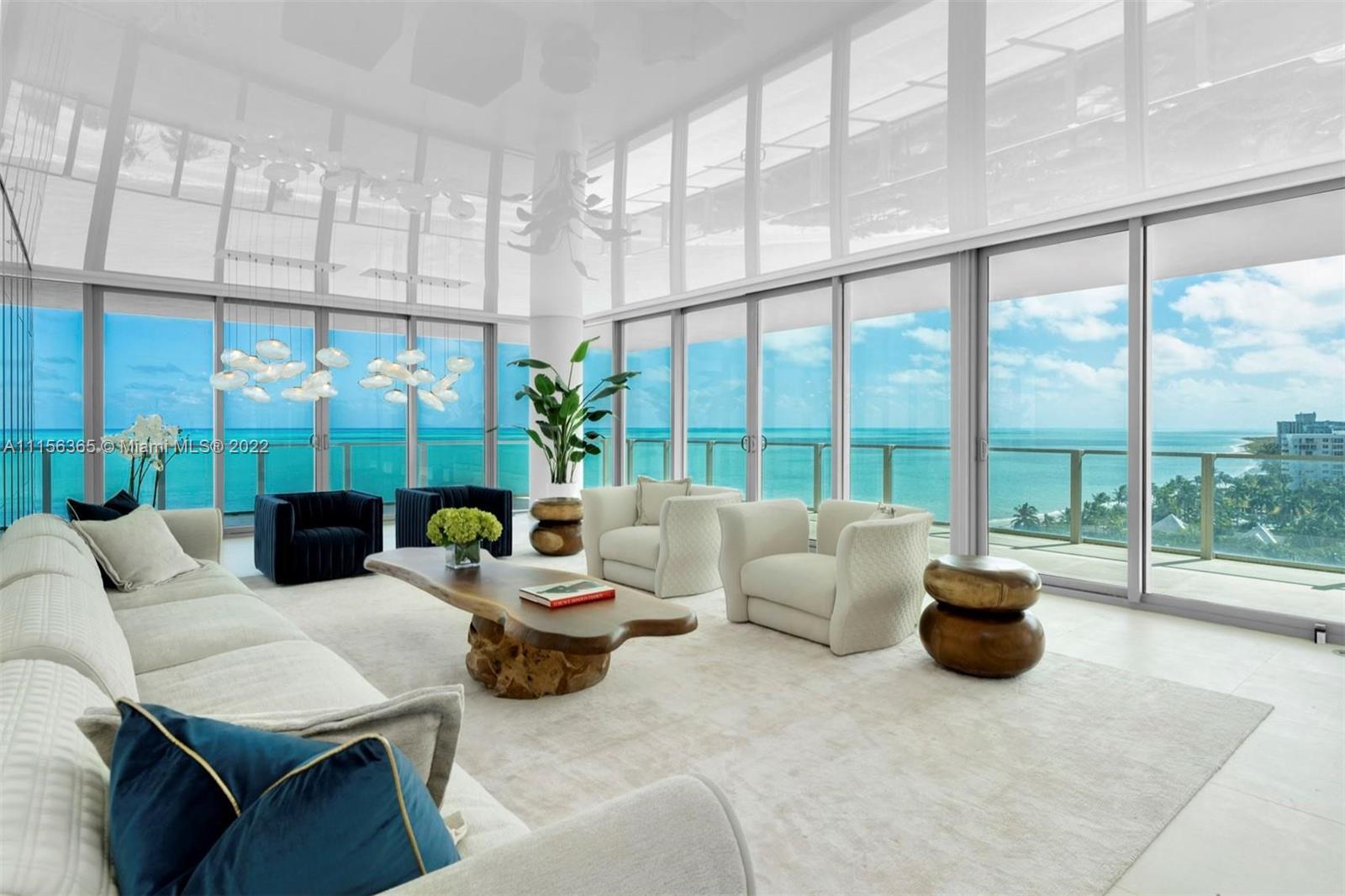360 Ocean Drive, Unit 1101S Key Biscayne, FL 33149 - Photo 1 of 65 a living room with patio furniture and a floor to ceiling window