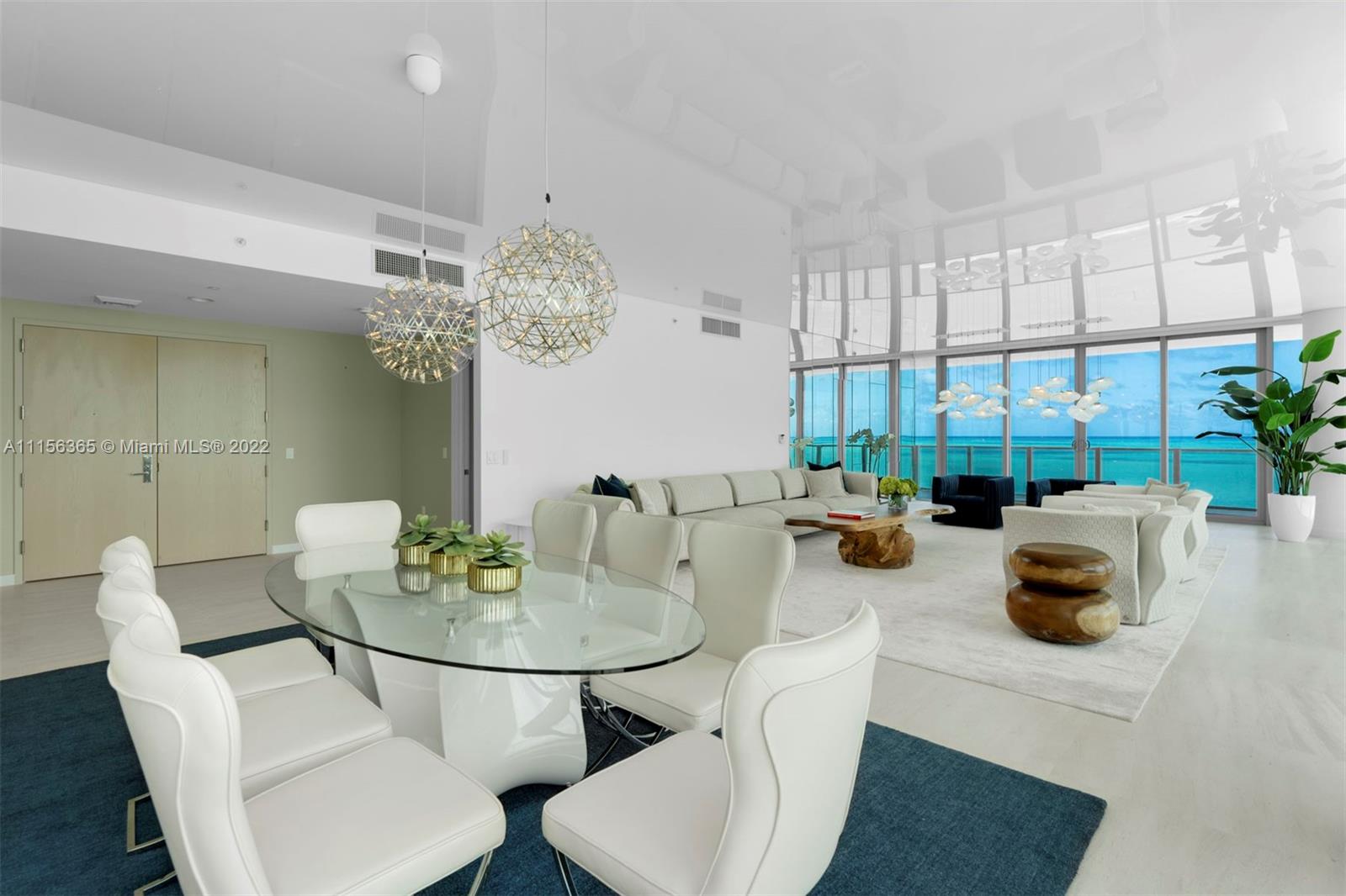 360 Ocean Drive, Unit 1101S Key Biscayne, FL 33149 - Photo 12 of 65 a view of a dining room with furniture and chandelier