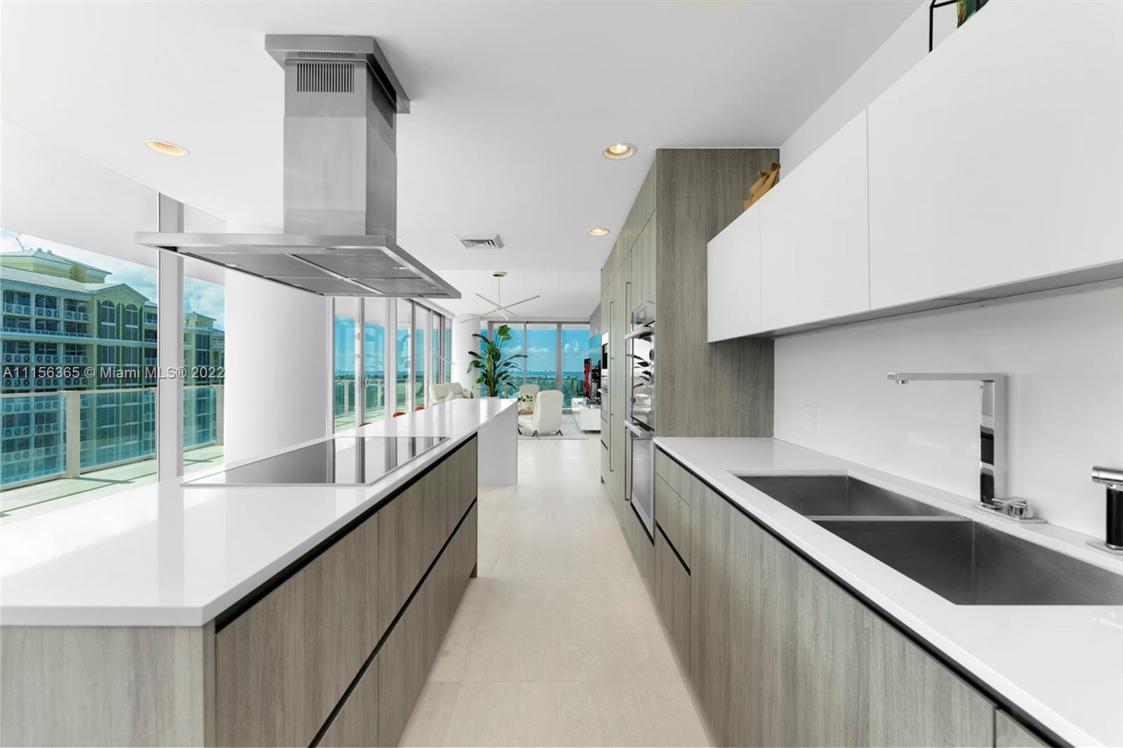 360 Ocean Drive, Unit 1101S Key Biscayne, FL 33149 - Photo 20 of 65 a view of a kitchen with a sink and cabinets