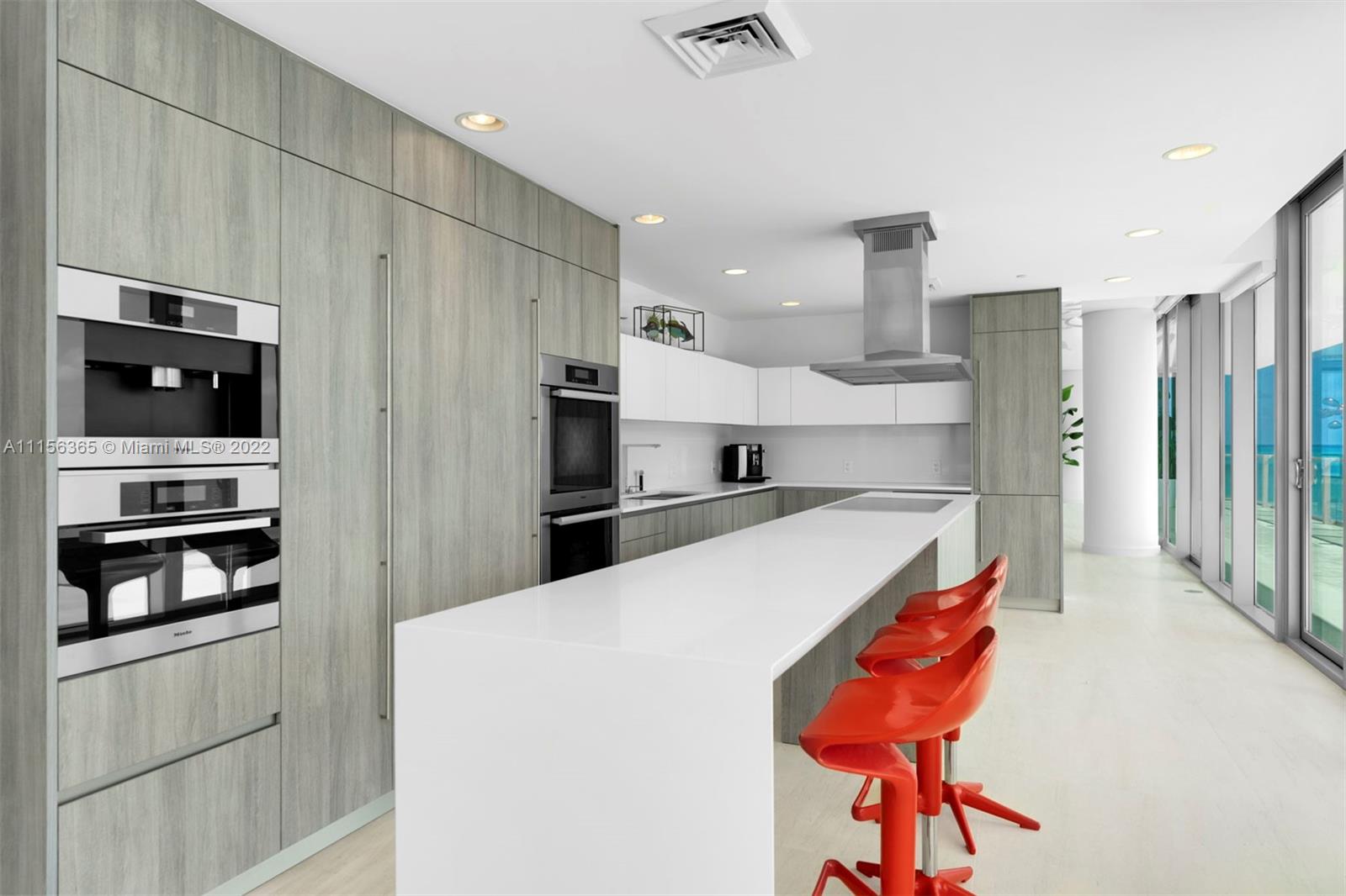 360 Ocean Drive, Unit 1101S Key Biscayne, FL 33149 - Photo 21 of 65 a kitchen with stainless steel appliances a refrigerator and a stove top oven