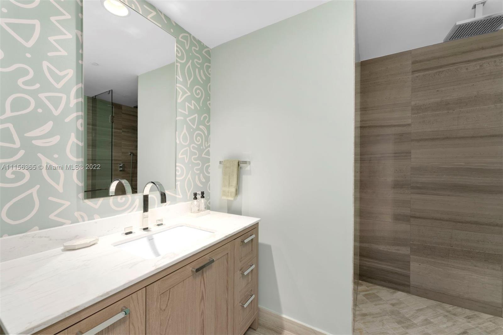 360 Ocean Drive, Unit 1101S Key Biscayne, FL 33149 - Photo 28 of 65 a bathroom with a sink and a mirror