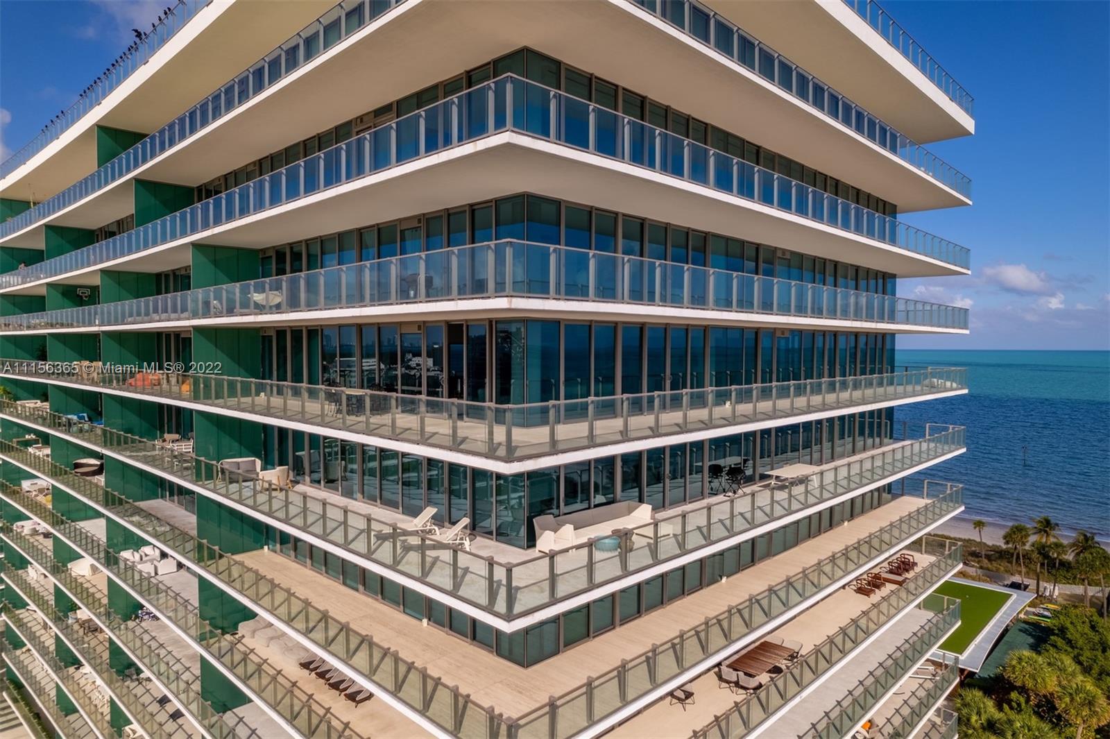 360 Ocean Drive, Unit 1101S Key Biscayne, FL 33149 - Photo 51 of 65 a balcony with tall trees in front of it