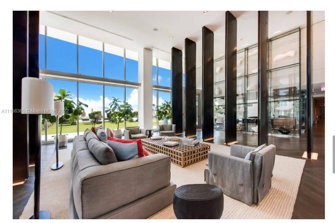 360 Ocean Drive, Unit 1101S Key Biscayne, FL 33149 - Photo 62 of 65 a living room with furniture and a large window