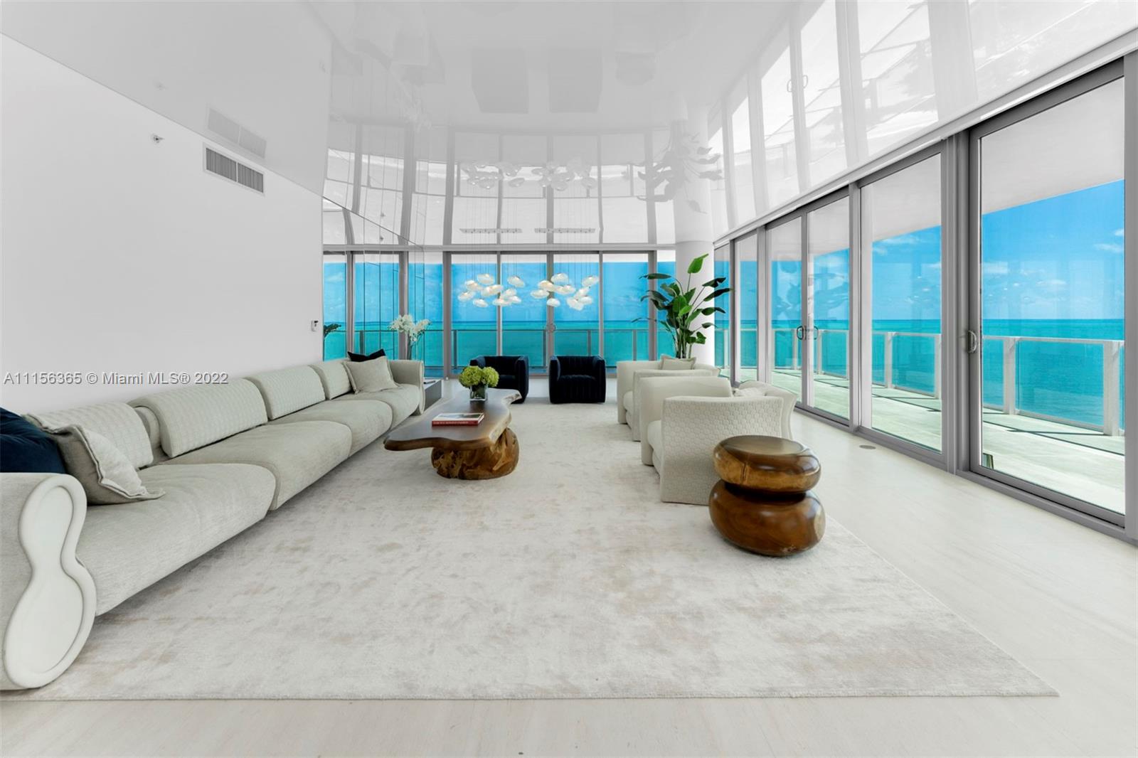 360 Ocean Drive, Unit 1101S Key Biscayne, FL 33149 - Photo 9 of 65 a living room with furniture and a potted plant