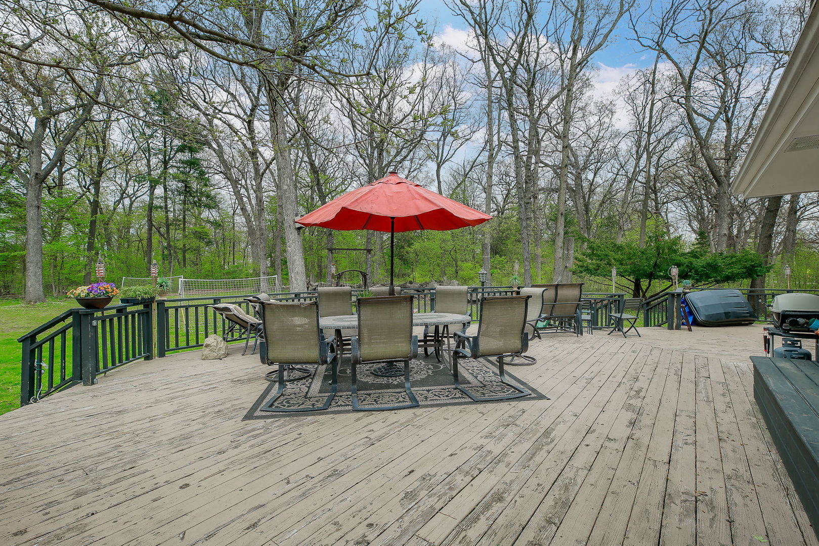 3309 York Road Oak Brook, IL 60523 - Photo 16 of 18 a view of a dinning table and chairs on the deck