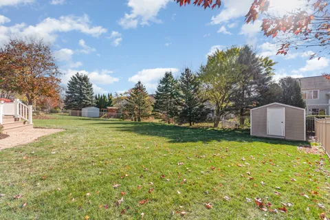 a view of a tree in front of a house