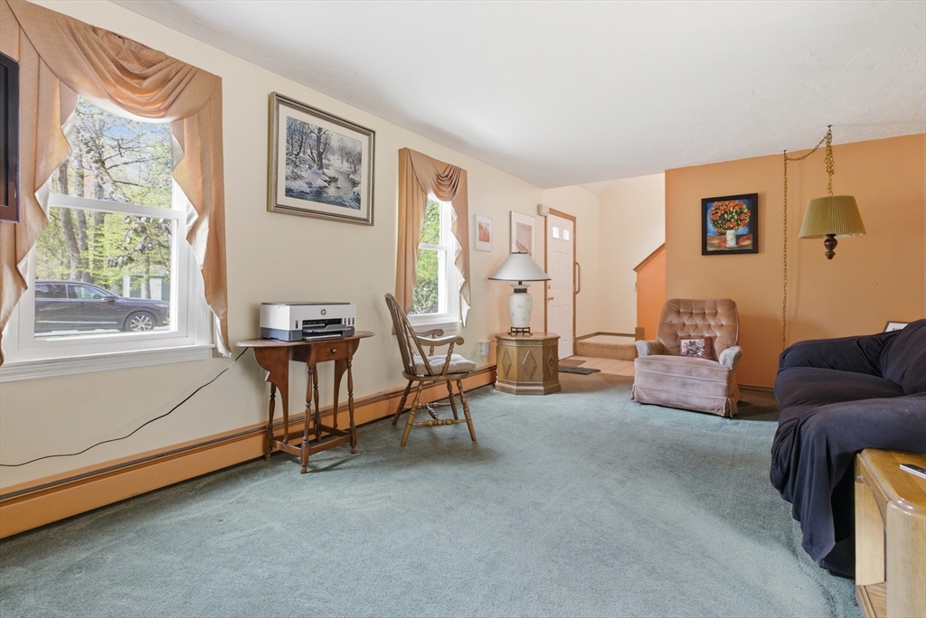 19 Mockingbird Lane Maynard, MA 01754 - Photo 4 of 34 a living room with furniture and a window