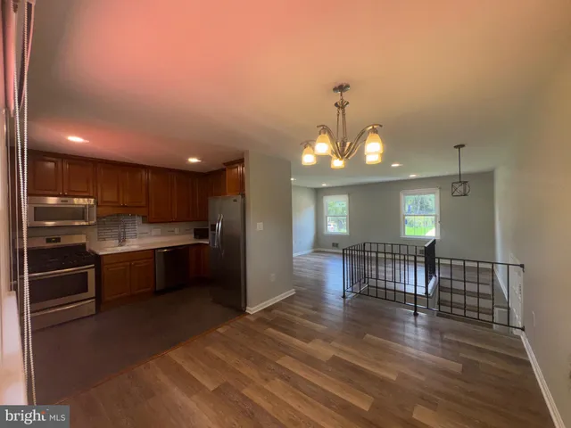 a view of a kitchen and dining room