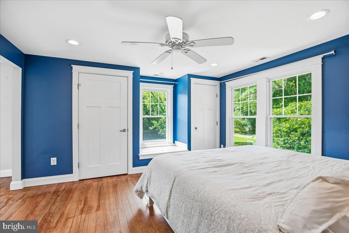 16146 Thomas Road Piney Point, MD 20674 - Photo 48 of 70 a bedroom with a large bed and a large window