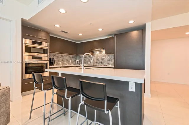 a kitchen with a table and chairs in it