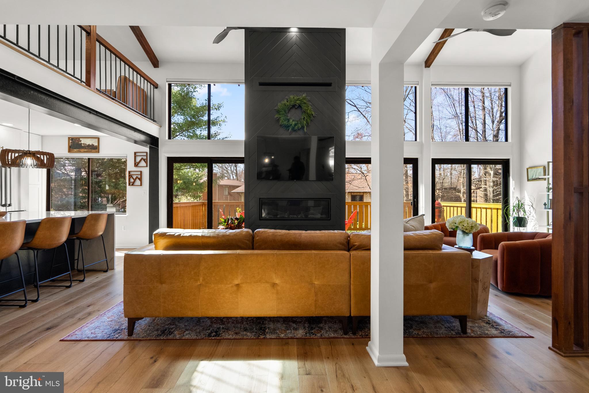 5213 Bradfield Drive Burke, VA 22015 - Photo 12 of 48 a living room with furniture and a floor to ceiling window